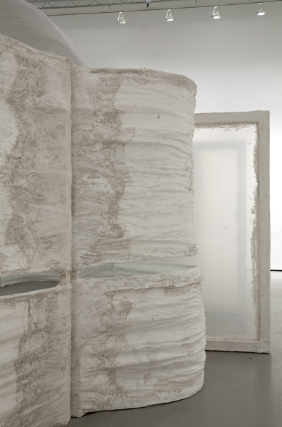 Untitled, 2014, variable size, plaster, burlap, plastic sheets, bricks, plastic emergency water storage bag, water