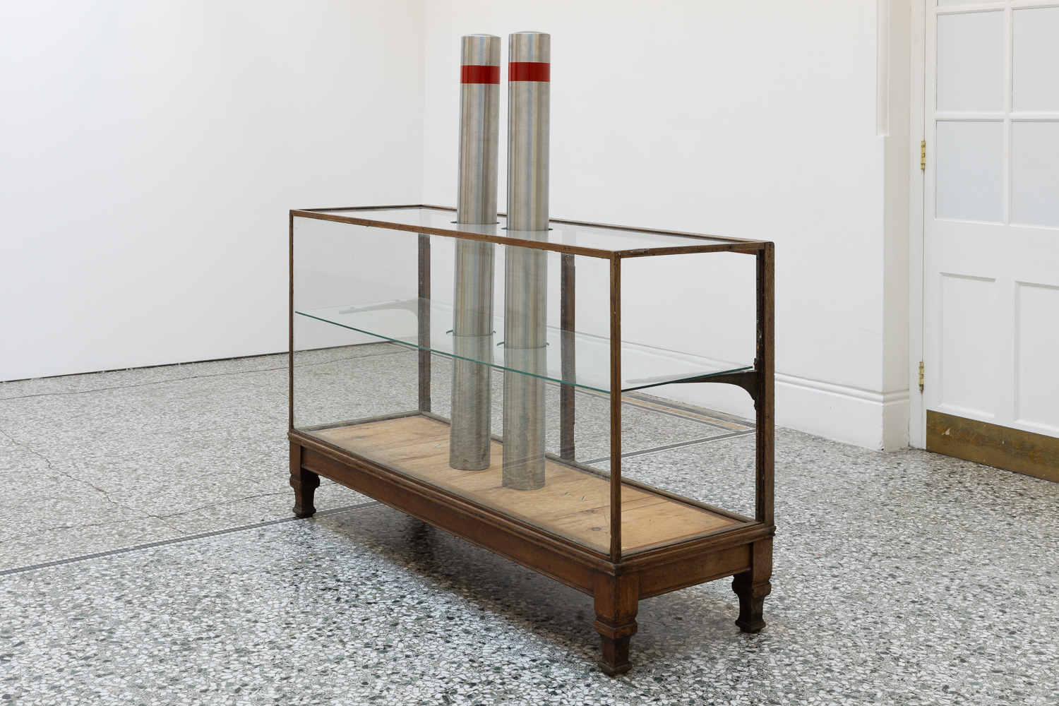 Hearted 2024 20th Century display cabinet, brushed steel bollards,