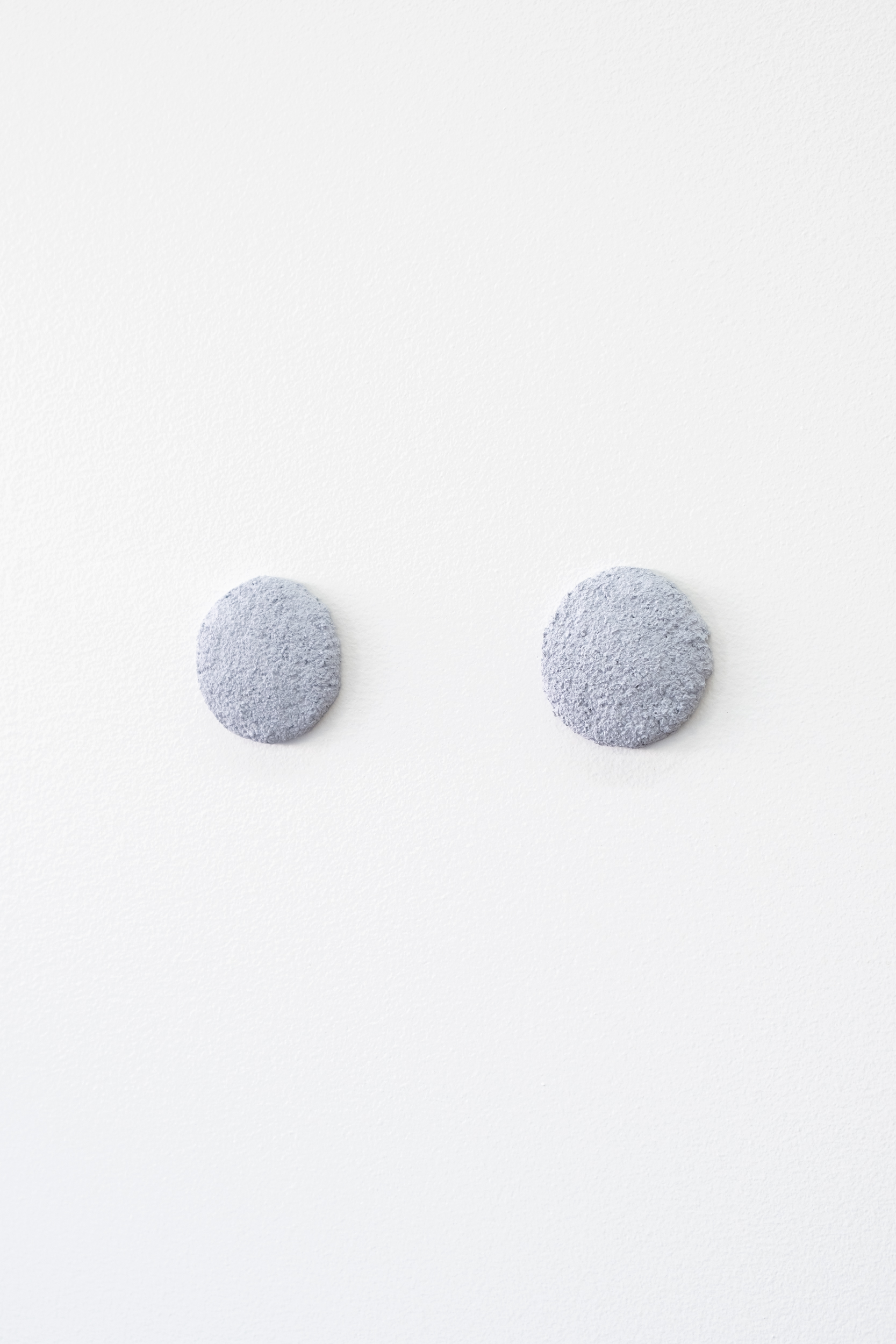 Mussel Eyes (1 to 10), 2022, 2" x 1 3/4” x 1 3/4” x 1/4”, Crushed Pacific blue mussel (Mytilus trossuluss) shells, gesso.