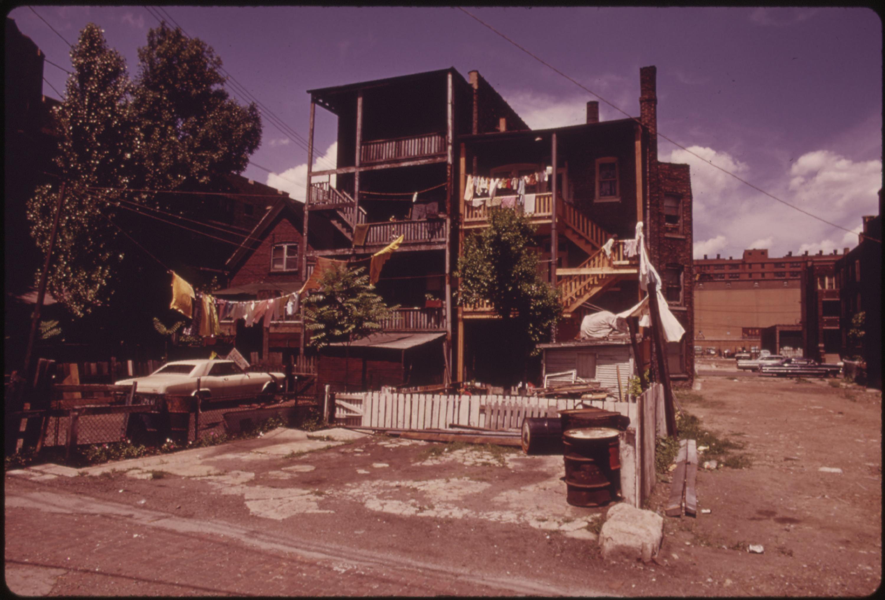 Black community older housing on Chicago’s West Side. This area in 1973 had not quite recovered from the riots and fires during the mid and late 1960s. According to the 1970 census, 22 to 29 percent of the residents were below the poverty level. Black West Side businessman formed an organization, funded by the federal government, which resulted in agreements with major national franchises and resulted in some $20 million in jobs for area citizens by 1974, June 1973.
