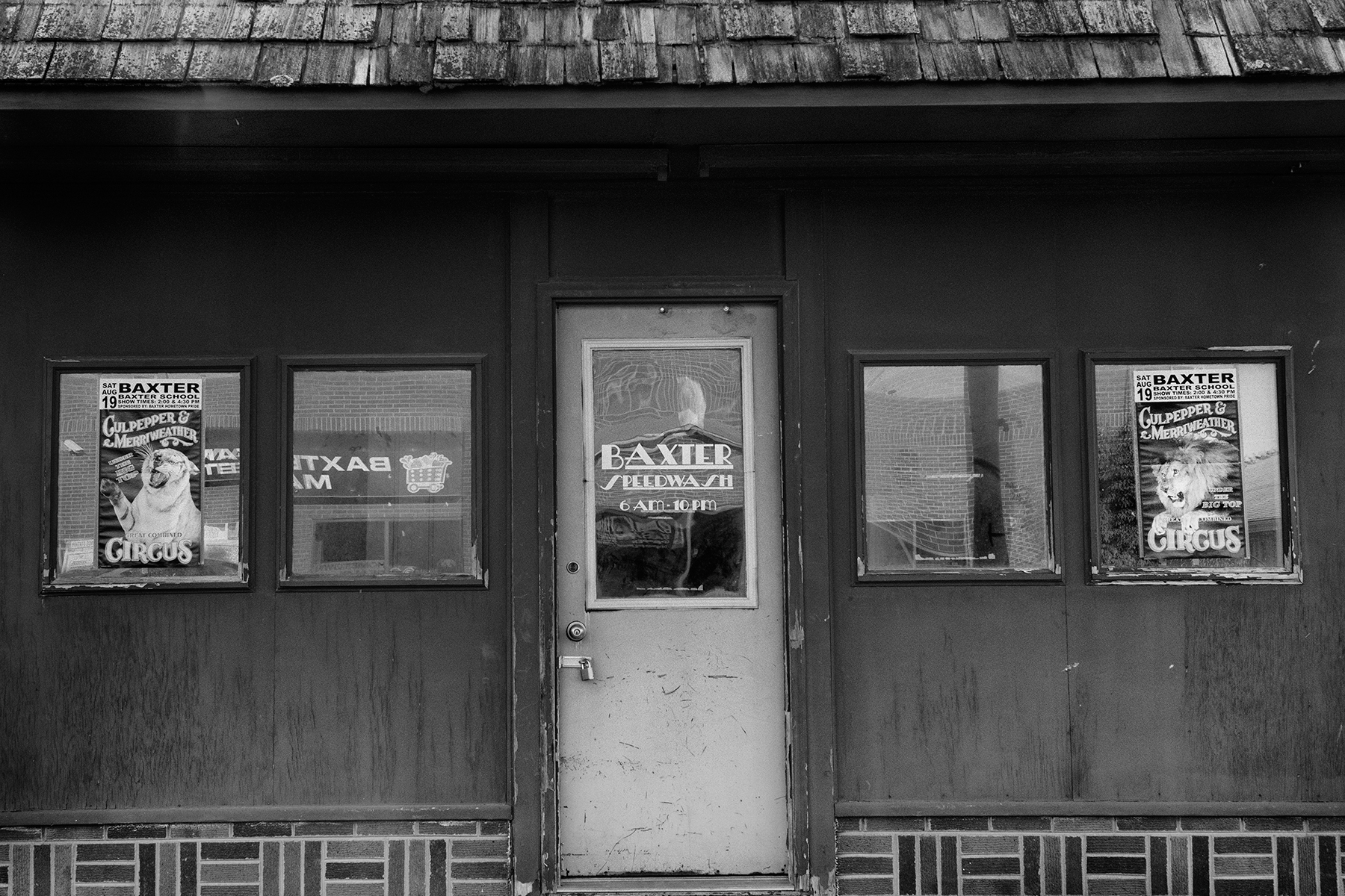 The circus poster appears on the window of a store in Baxter, Iowa.