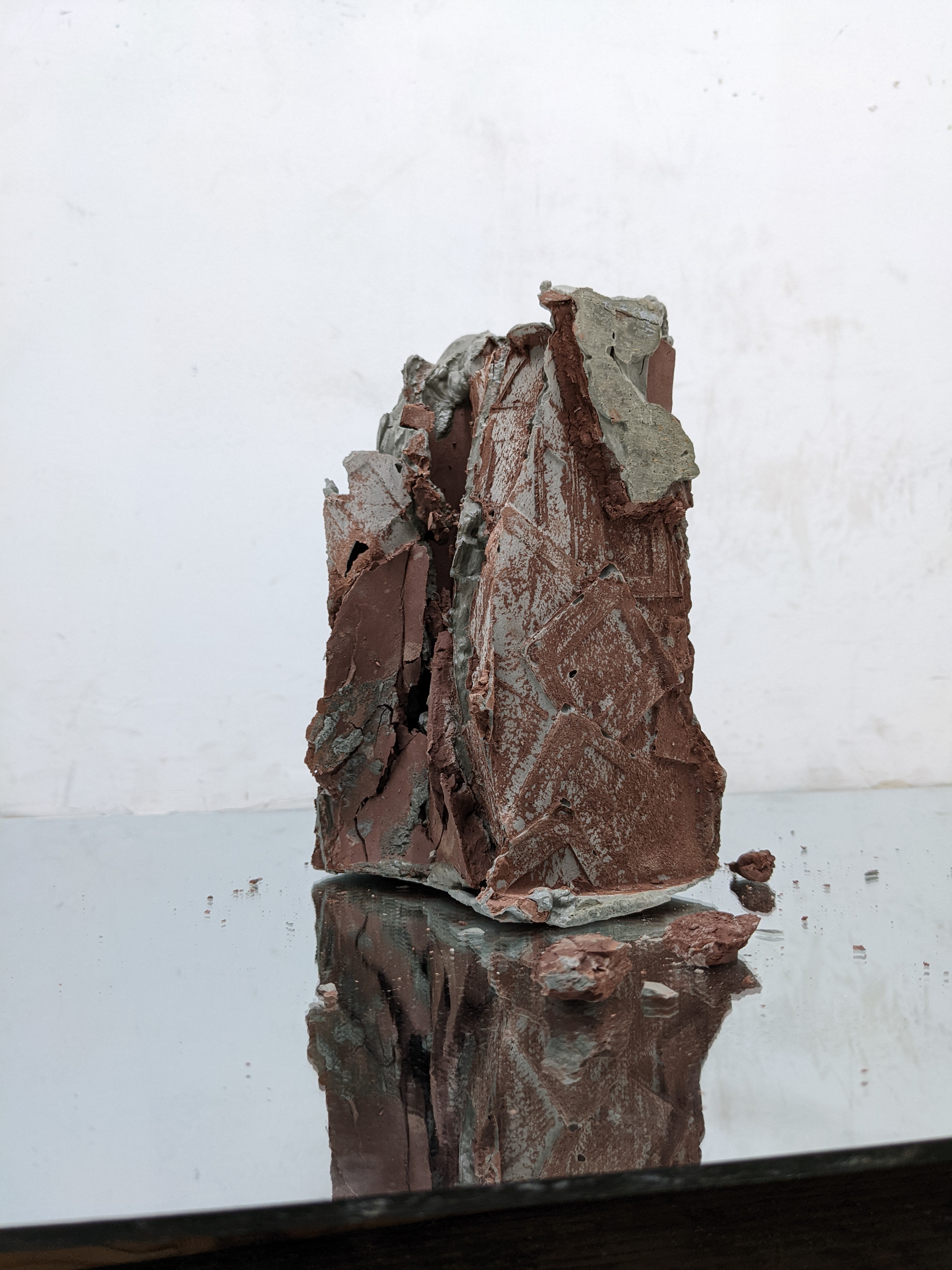 Cement Cast, of 35mm slides, red raw clay, mirror, 2021