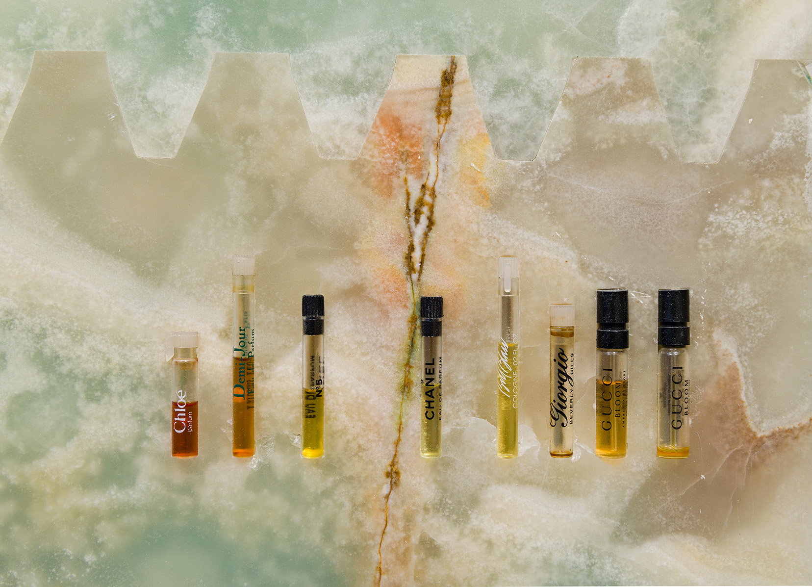 Details of Catherine Telford Keogh, "Sampler," 2024. Green onyx, multicolor onyx, See By Chloé™ Si Belle, Demi Jour By Houbigant Eau De Parfum, CHANEL® N°5 Eau de Parfum Spray, Giorgio Beverly Hills For Women, Eau De Toilette, Gucci® Bloom For Women Perfume Collection Sample Spray Vials Set, VERSACE CRYSTAL NOIR by Gianni Versace Gift Set Shower Gel & Body Lotion, Versace Eros, Zizanie 'Discord' Sampler Cologne, 36 x 21 inches. Photo by Etienne Frossard.