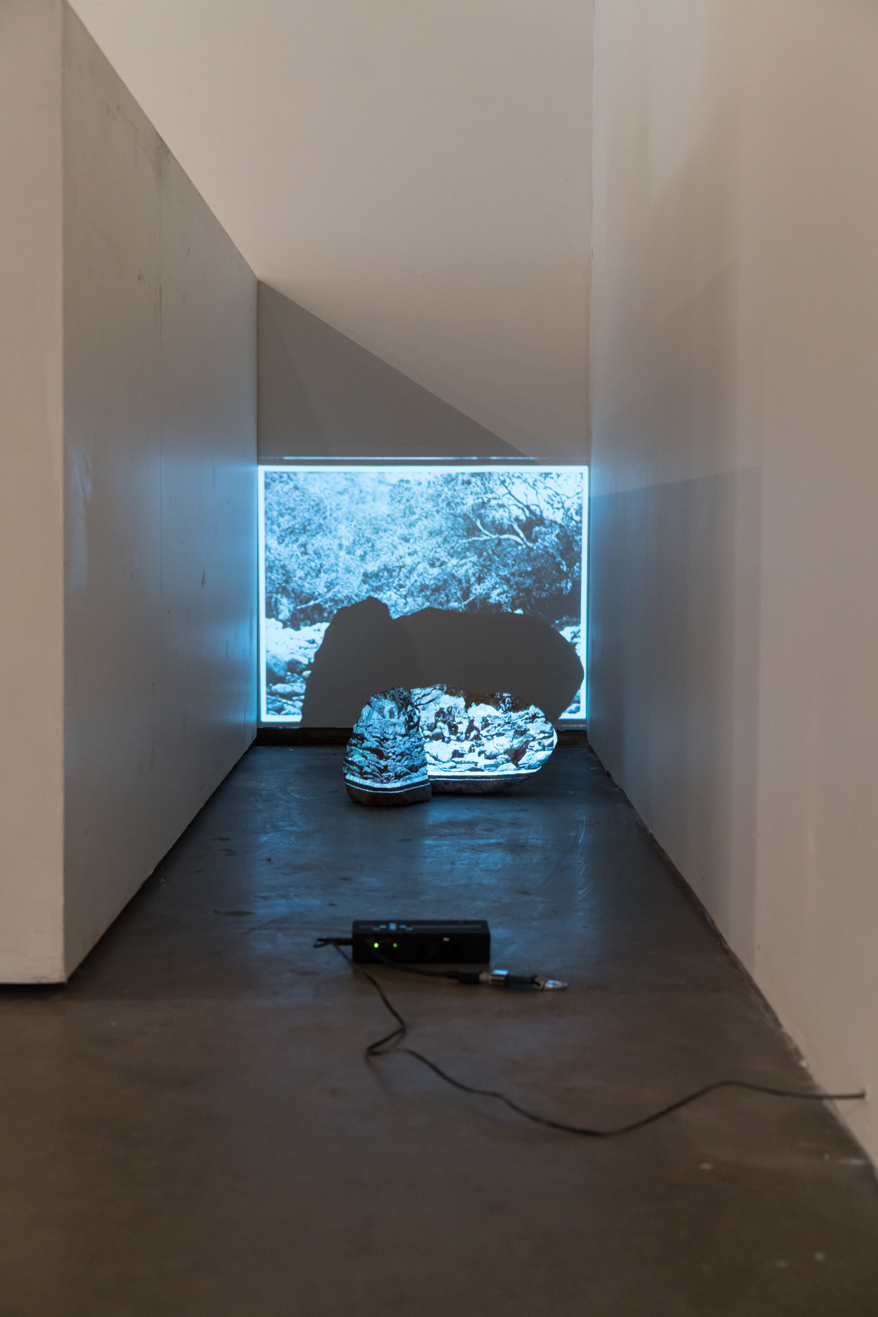 untitled (intervention), 2016, projection of appropriated photograph* and rocks, dimensions variable *British Royal Engineers during the Magdala, Ethiopia Military Operation 1867-68. Source: CO 1069-5-33 (Public Domain) by The National Archives UK  ICOSA/EAST, ICOSA Collective Gallery, Austin, TX,November 12 - 13 & 19 - 20, 2016