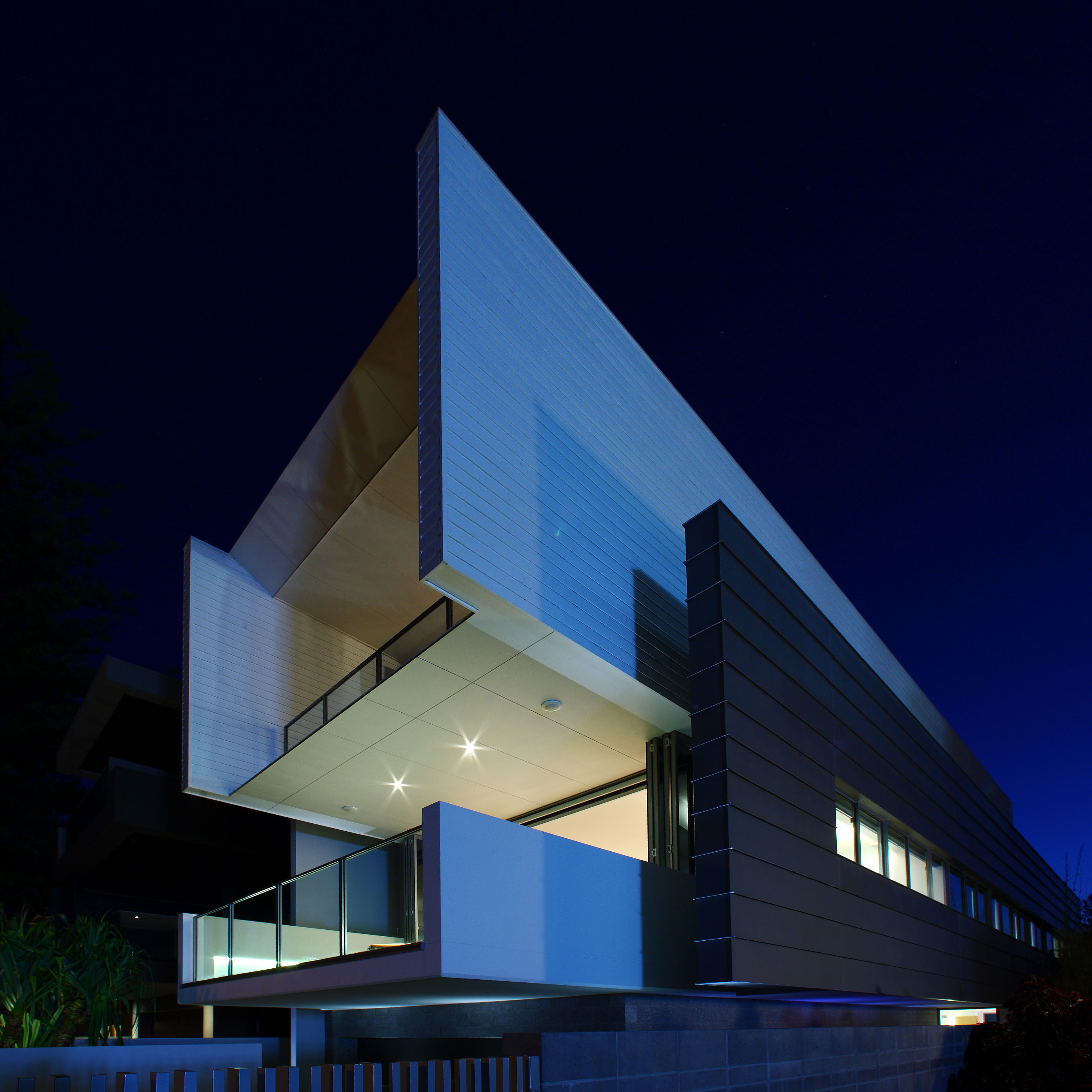 View of the dramatically cantilevered form of a contemporary residence in Miami on the Gold Coast.