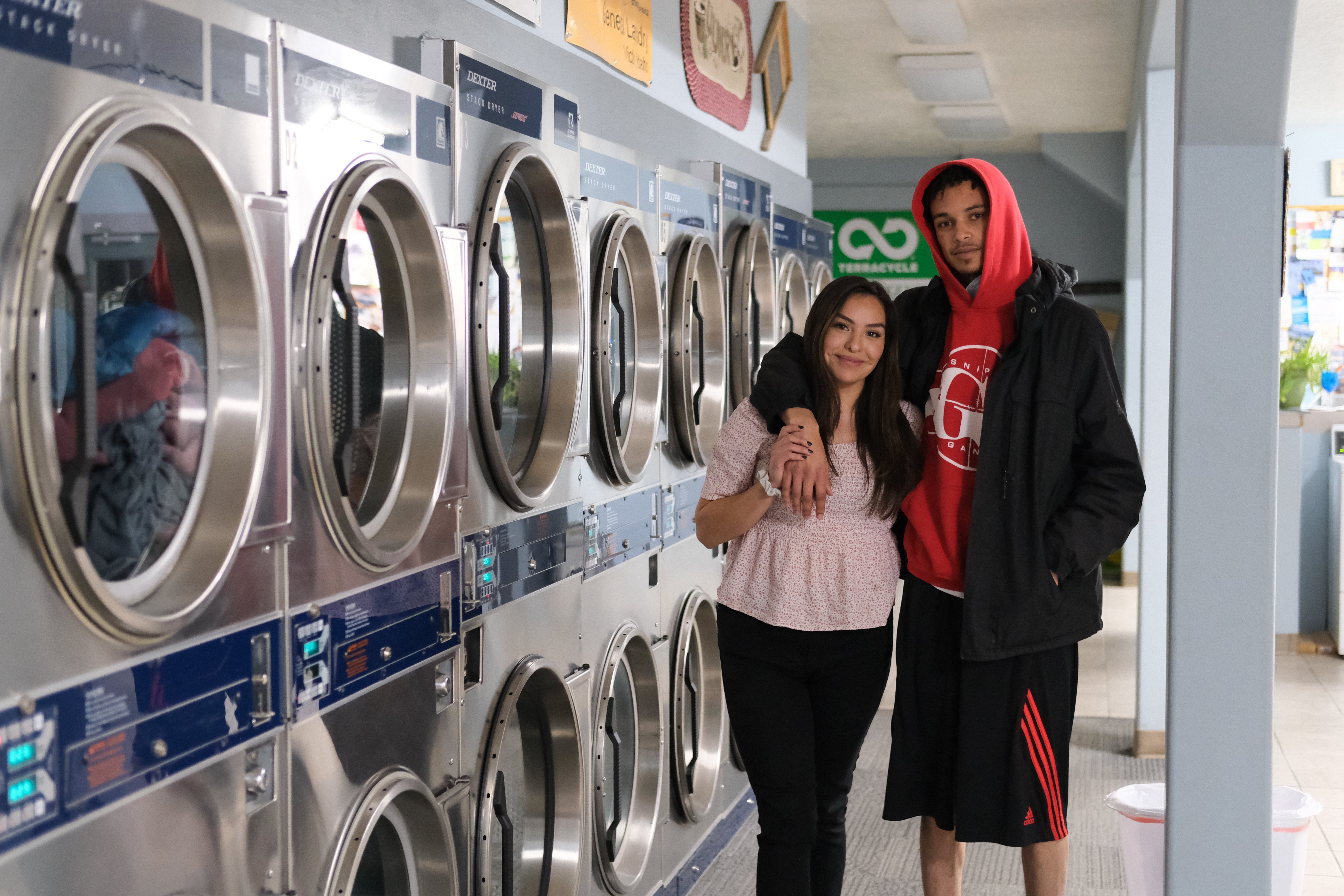 Jamie (left) and AJ finish up laundry at midnight in Victor, ID. They recently moved in with each other. Link to full story: tinyurl.com/genppAJ