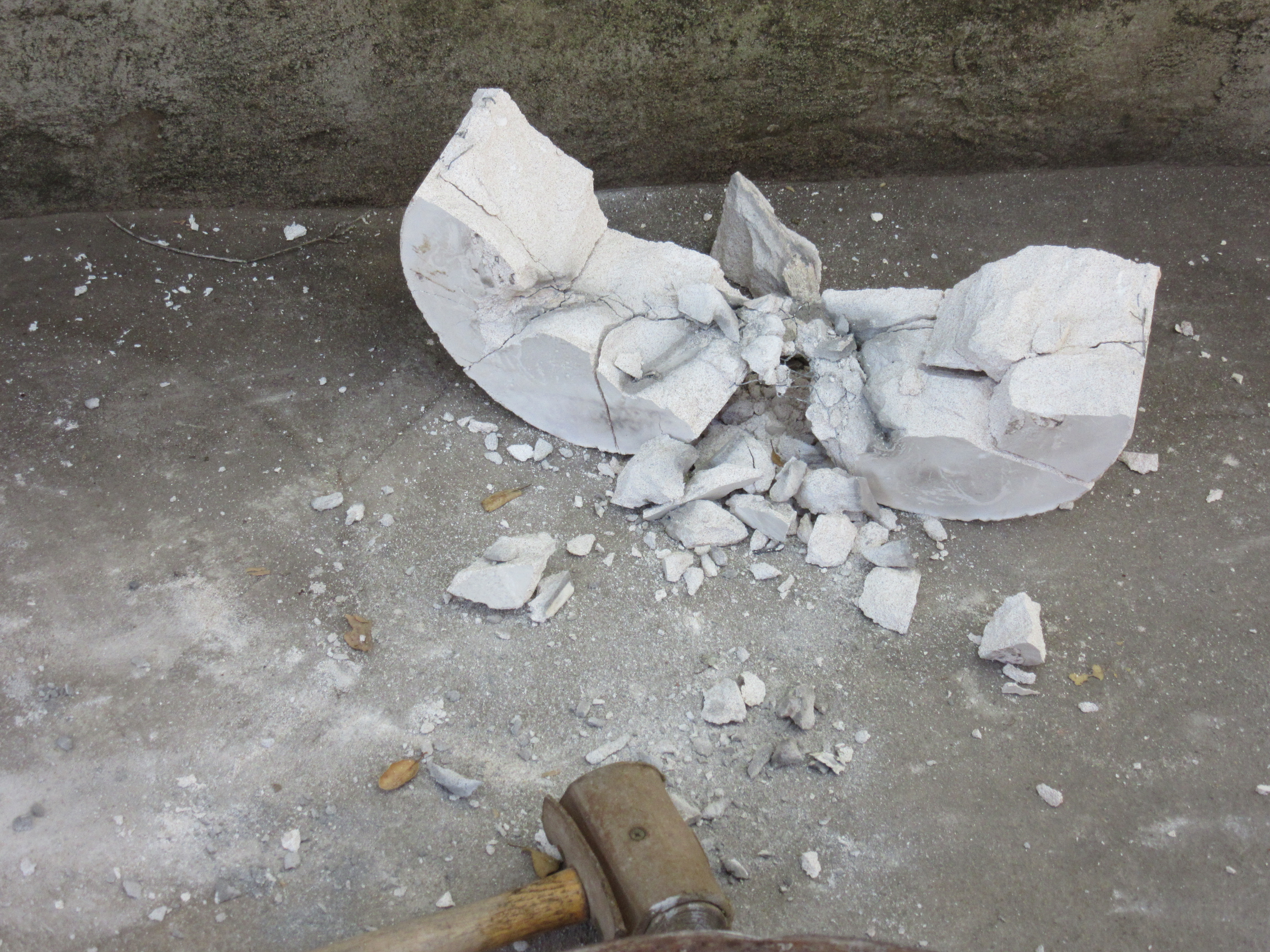 After cooling, the mold is broken to free the sculpture