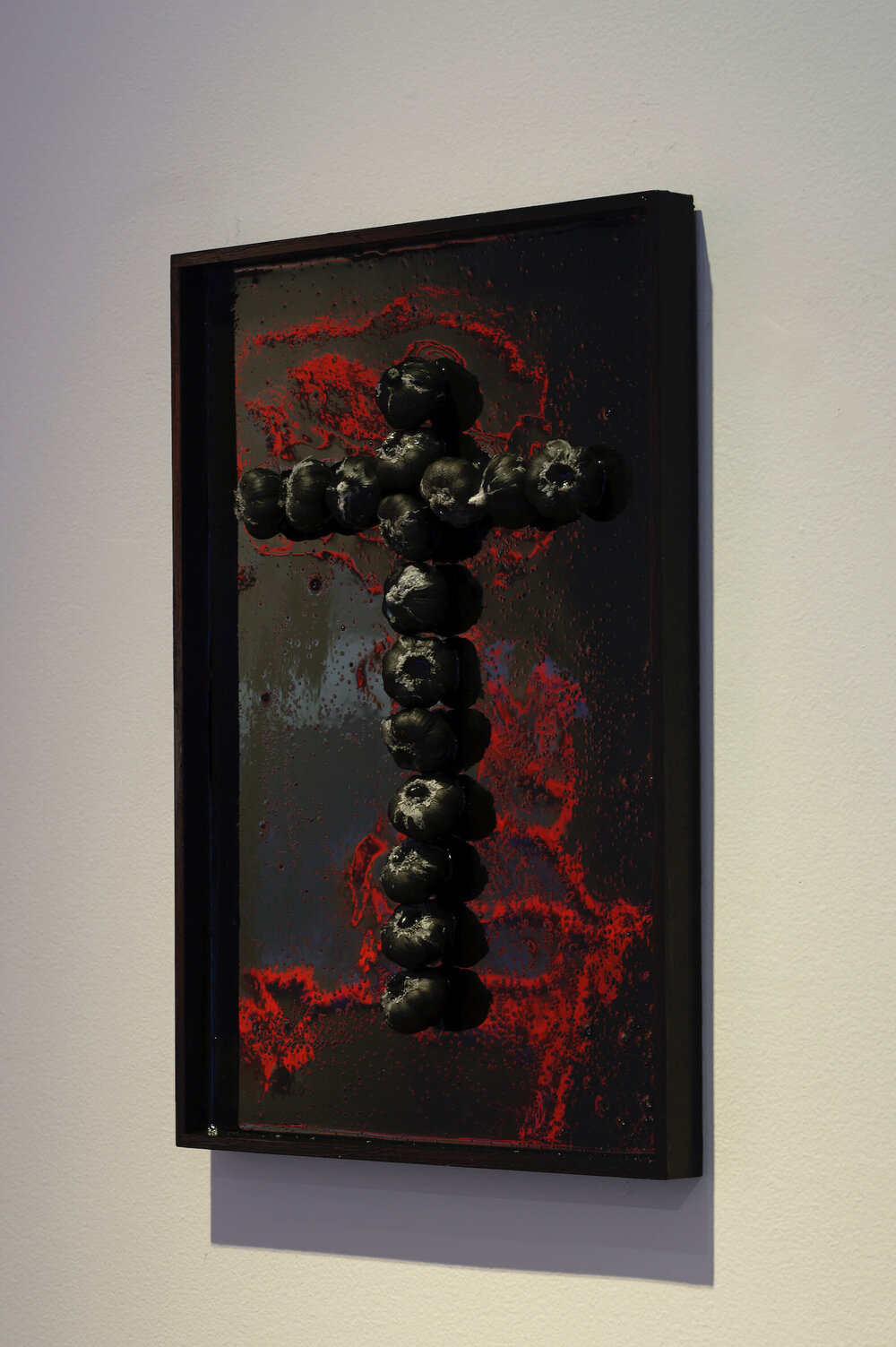 'Protective Sign', black resin, 59.4 x 42 cm. Photography by Aaron CV Rees