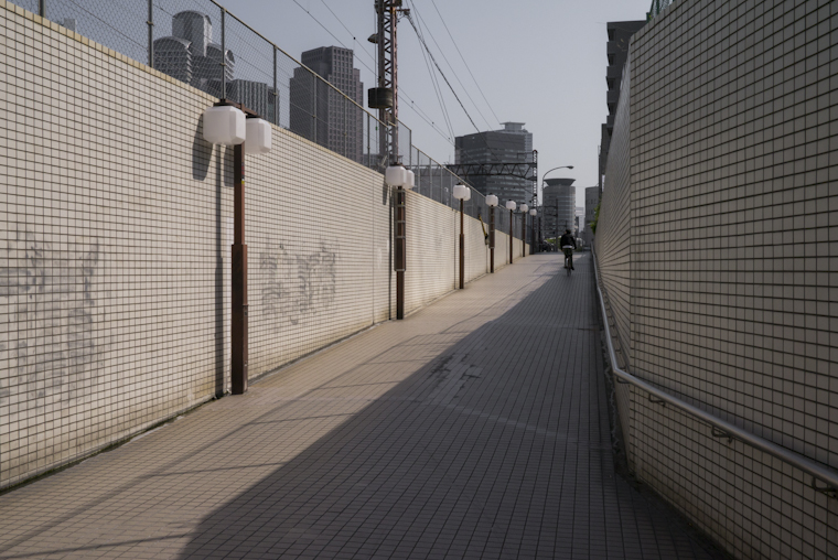 view of a man riding away // osaka