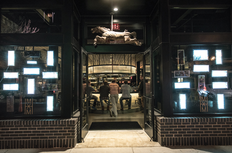 Trick Pony is an intimate space, raw in finish. Lighting is subtle, with focus placed on the glass rods surrounding the bar. Photo by Daniel Driensky.