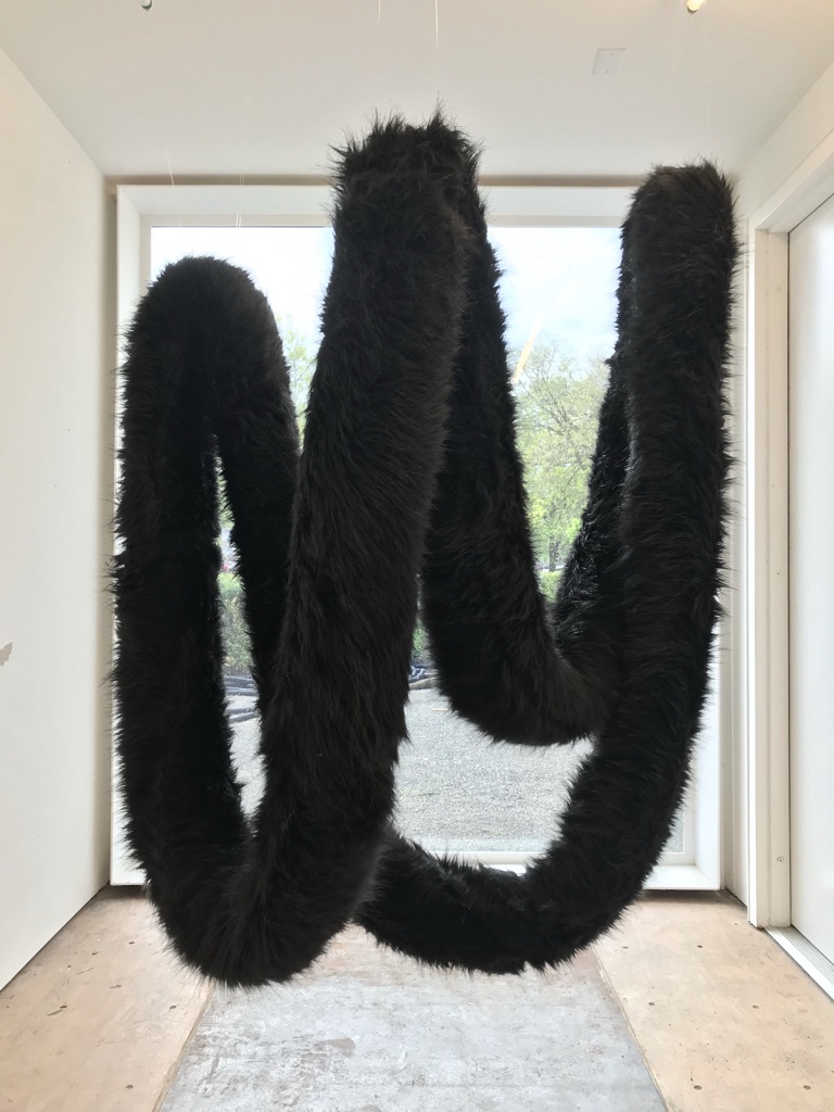 Fur Piece, 2019. Faux fur, thread, fabric, fishing line, 135" (length) x 16" (circumference).