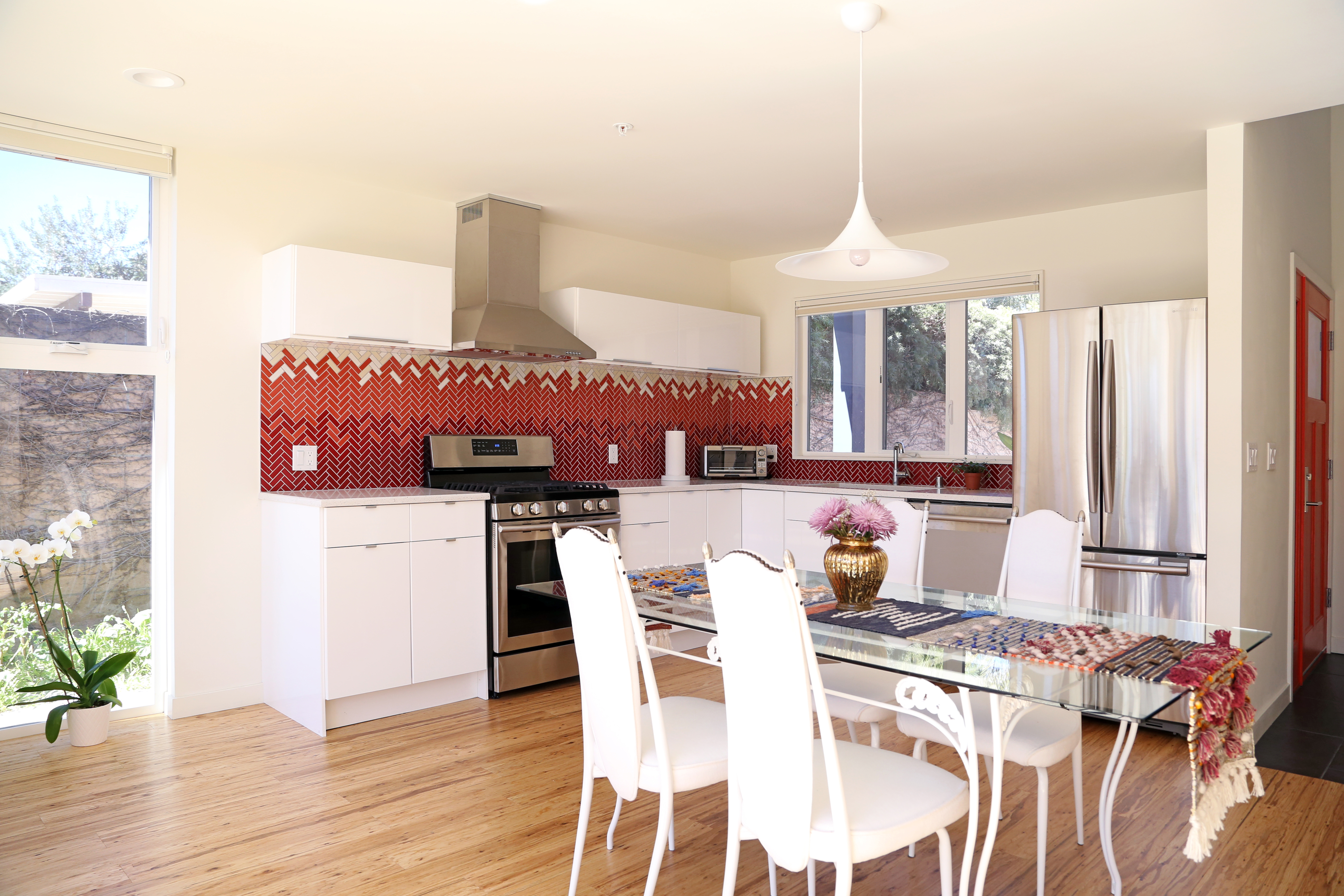 Tile was selected from Heath Ceramics overstock factory. An eclectic herringbone pattern was carefully designed to utilize the limited quantity of coordinating tile shapes and colors.