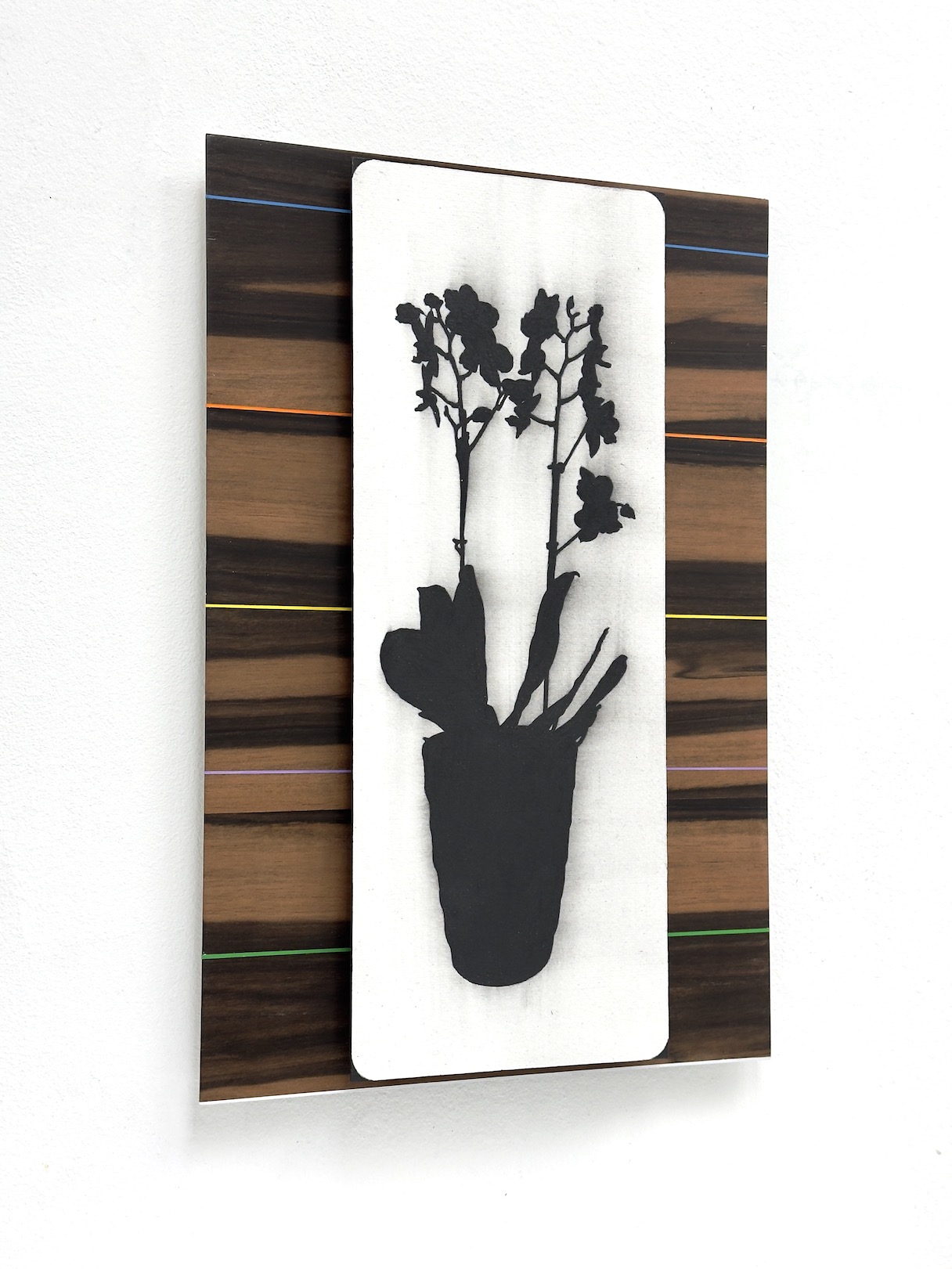 ‘An attempt to grasp the fragrance’, 2024, conté pencil and acrylic on paper/aluminium and Macassar Ebony wood veneer/aluminium, 30 x 20 cm.