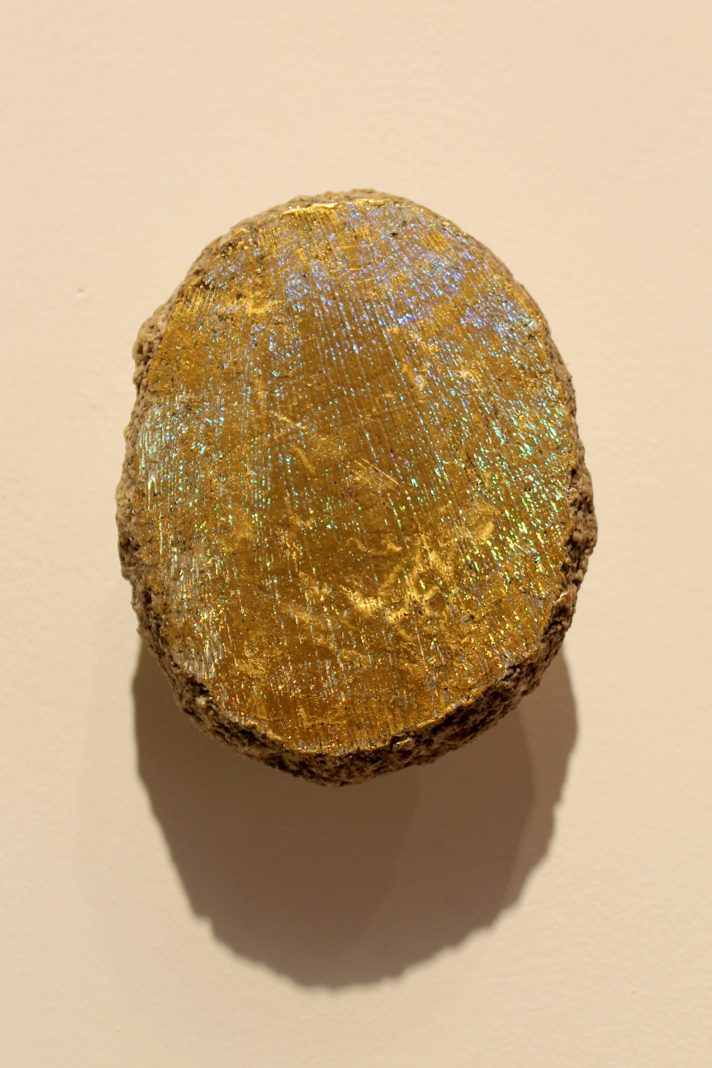 Iowan Erratic, 5 x 8 x 3 inches, brass, hot-pressed foil and Iowan Glacial Erratic 