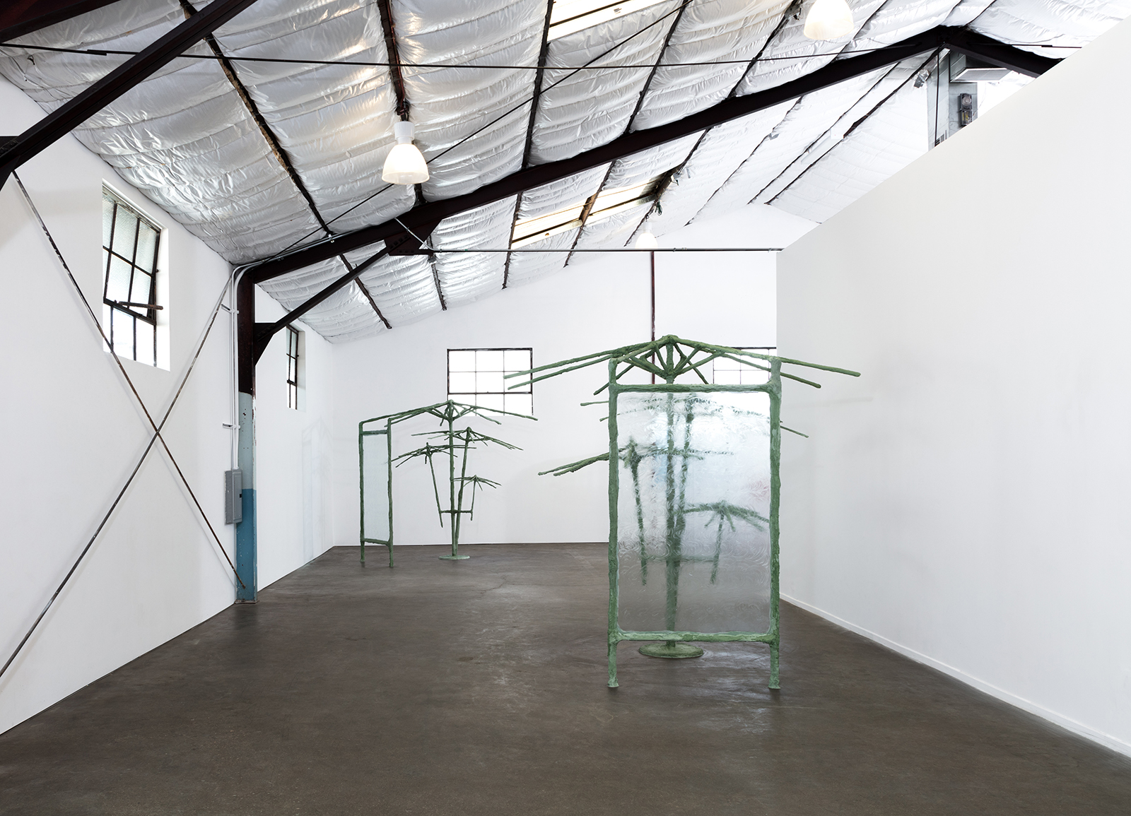 One in the mouth and one in the heart, 2018, umbrellas, steel, plaster, burlap, sand, pigment, glass, vaseline