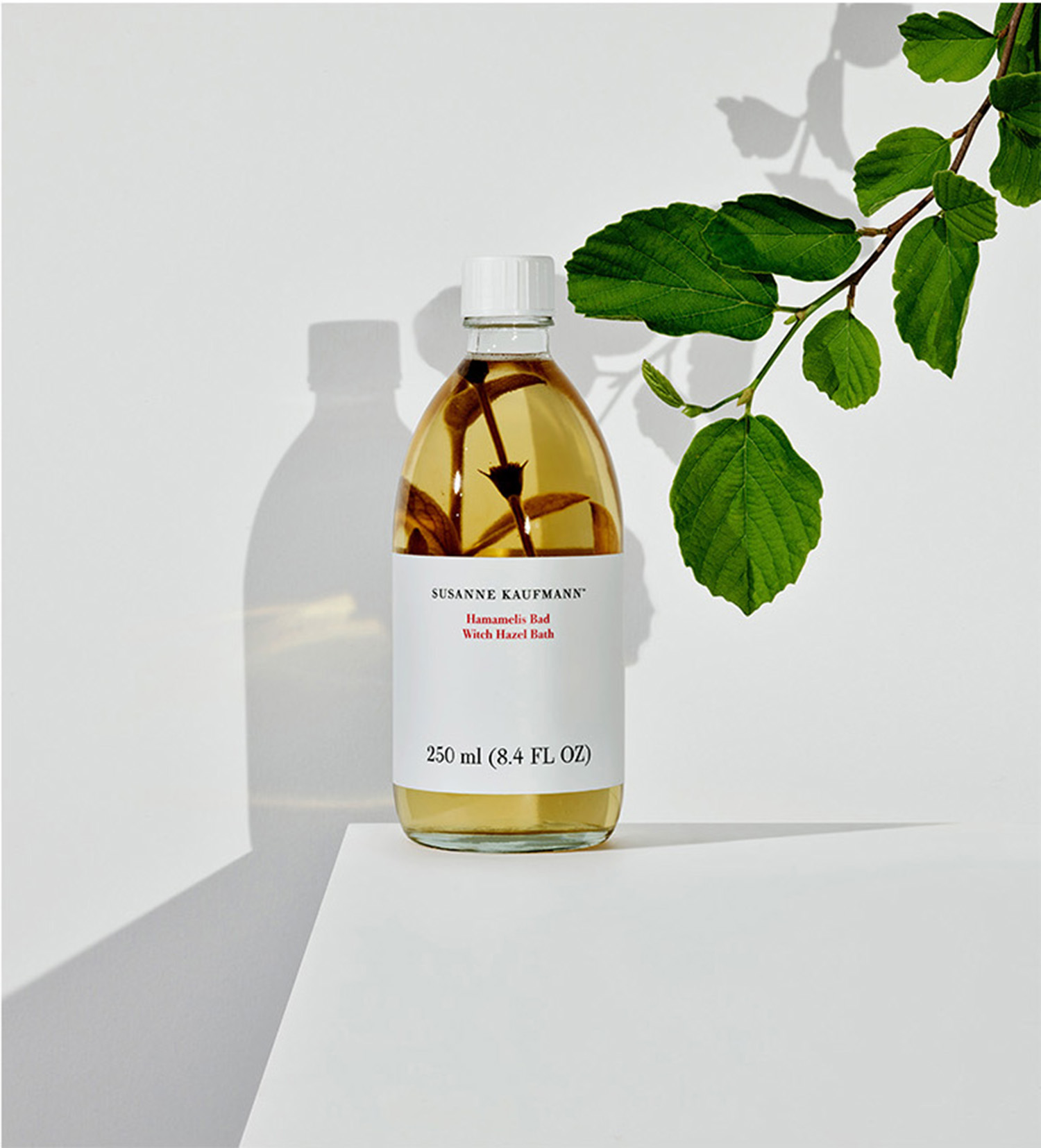 KMA stylist Sara Wacksman designs set for photo of Susanne Kaufmann bath oil surrounded by vines for CR Fashion Book