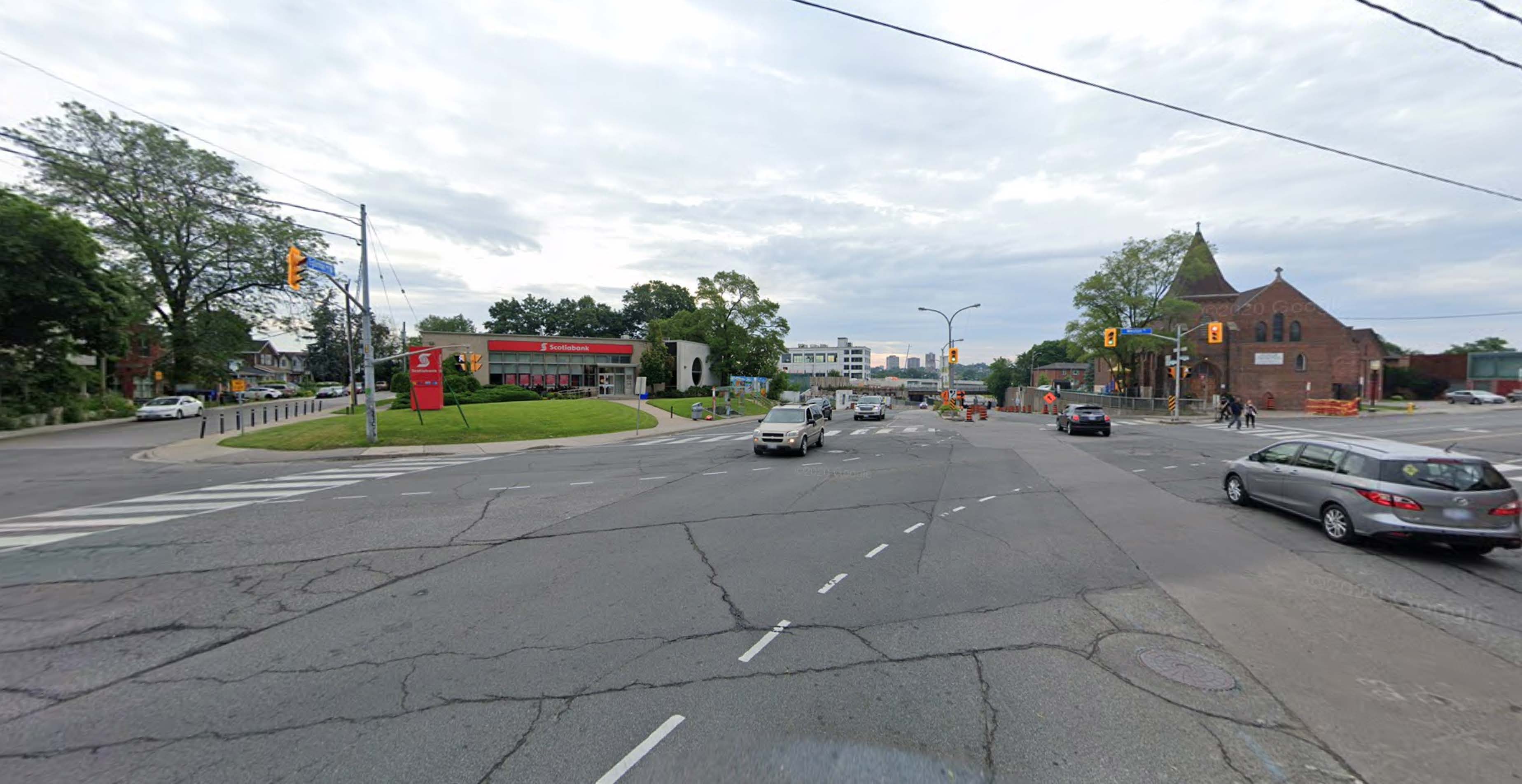 Wide intersection draws speeding cars and create opportunities for criminal activities to thrive. Scotiabank has been prone to robbery over decades