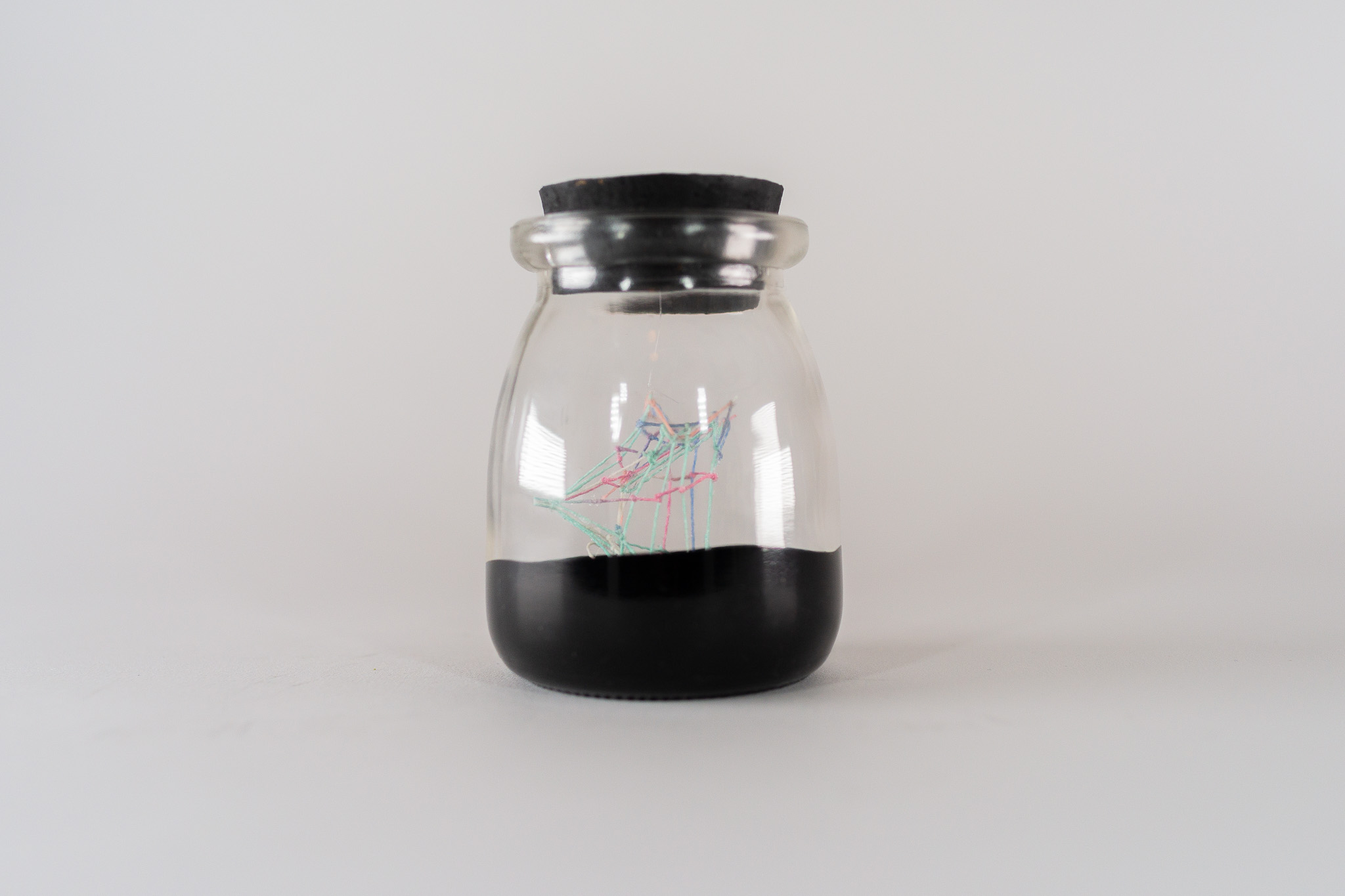 Small Ideas 3 • Embroidery floss, paint, glass jar • 2 1/4 x 2 1/4 x 3 1/2 in • 2022