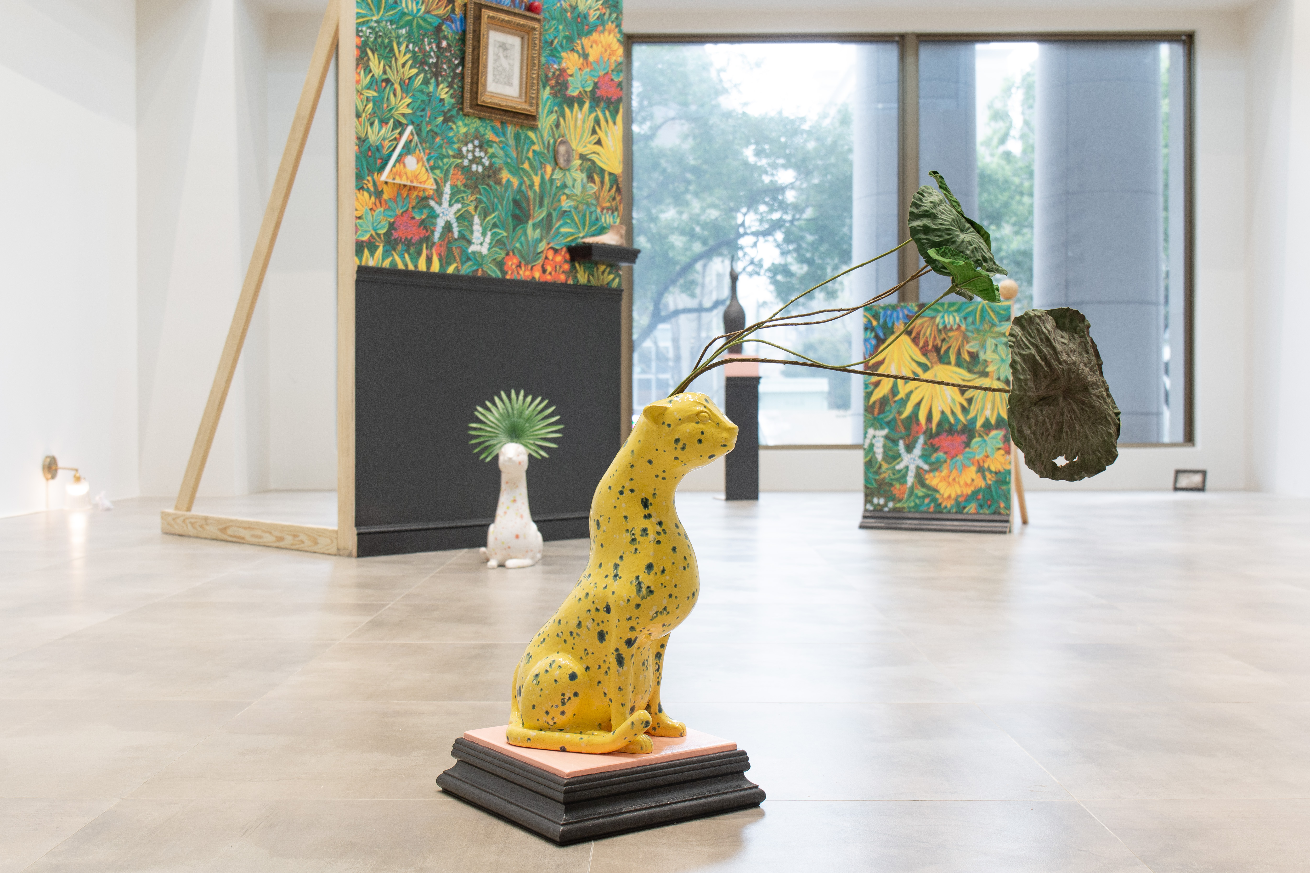 cat iiistoneware, glaze, plastic lotus leaves, wood, paint.cat dimensions 35.6 x 46 x 20.3 cm (14 x 18 x 8 in)