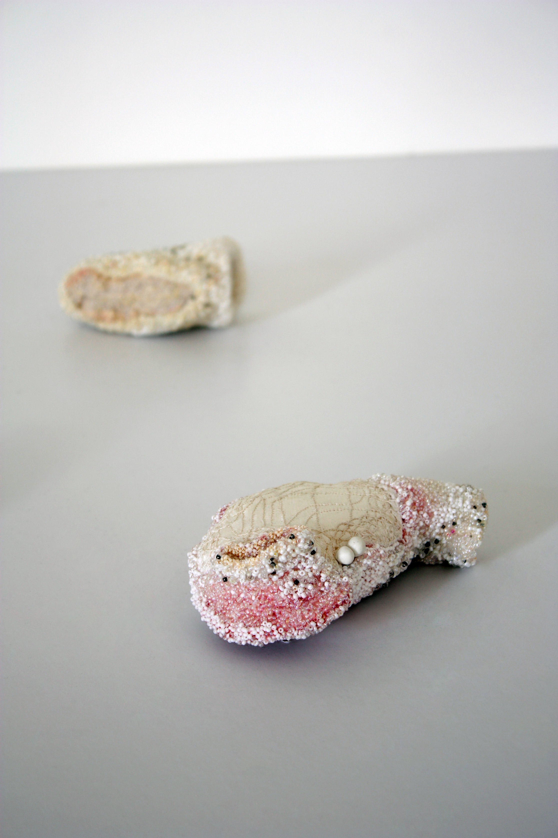 Brancos, 2002/2003 . Hand made felt, hair, fragments of silk and cotton embroidered with glass beads. Sizes and dimensions variable. ‘Embraced Jewellery Sites’ at Gustvsbergs Konsthall 2011, Sweden