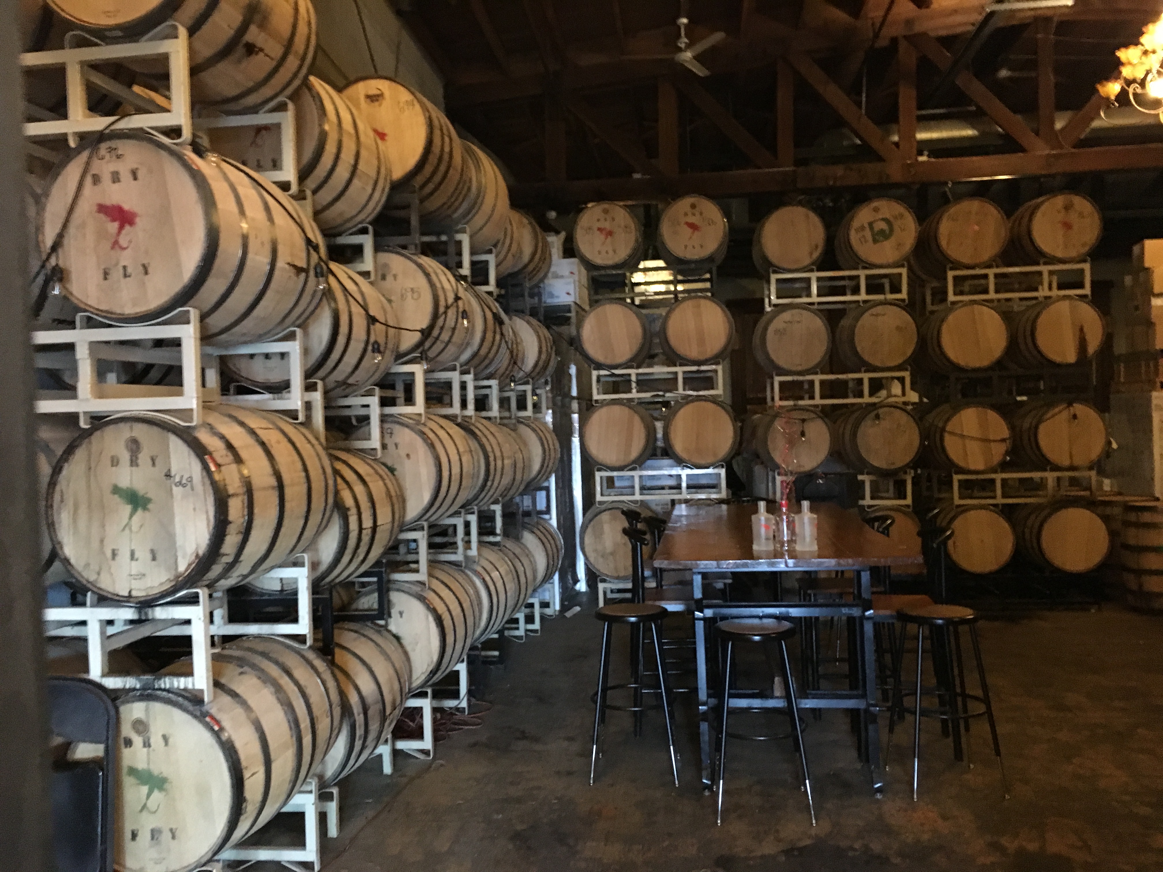 Barrels aging in warehouse