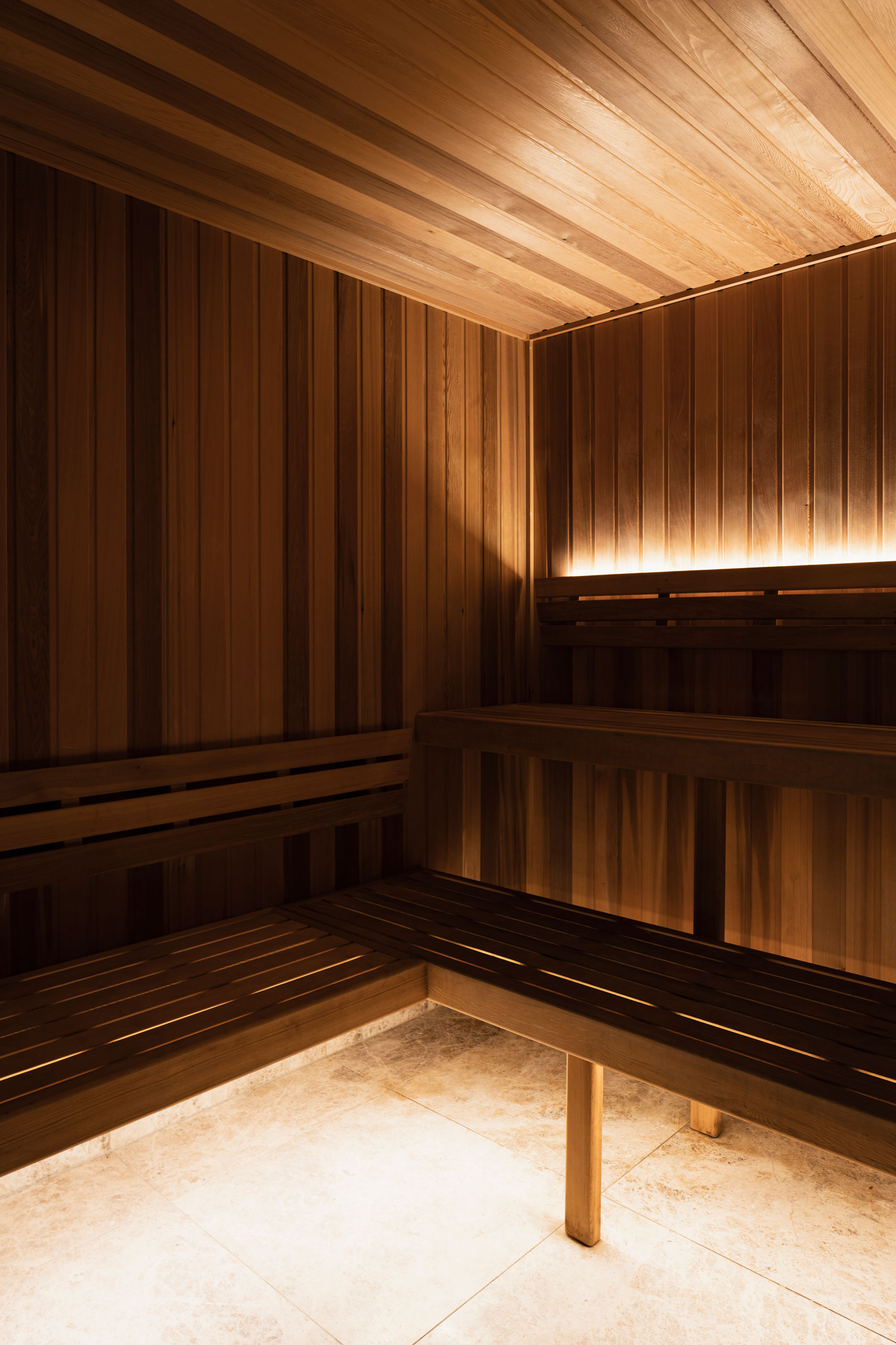 Wooden sauna with strip lighting within a modern apartment building on the Gold Coast.
