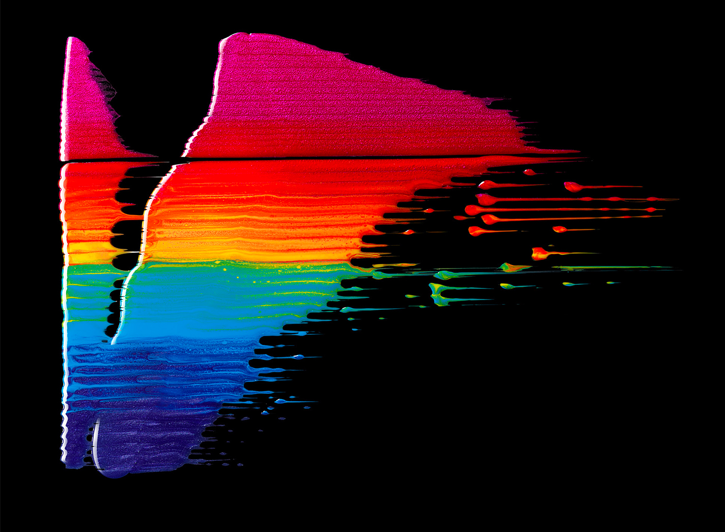 KMA photographer Isabelle Bonjean shoots a close up texture photograph of glossy smeared rainbow paint