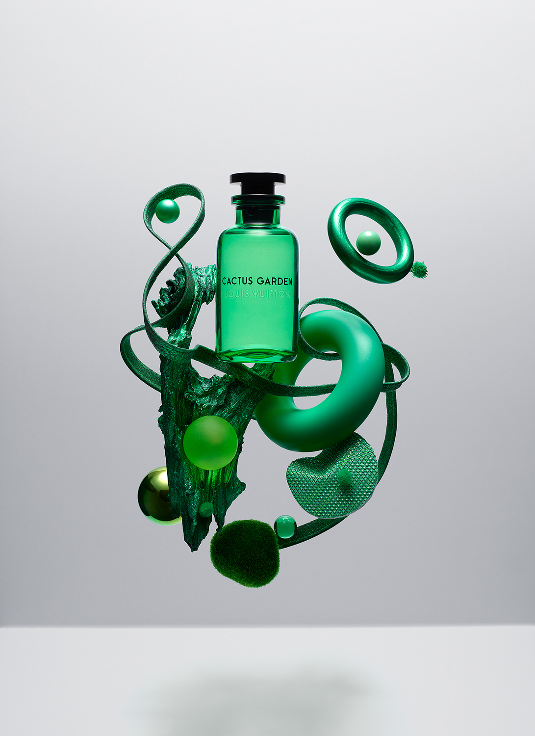 KMA photographer Isabelle Bonjean shoots photograph of floating green perfume bottle for Faux Q Magazine 