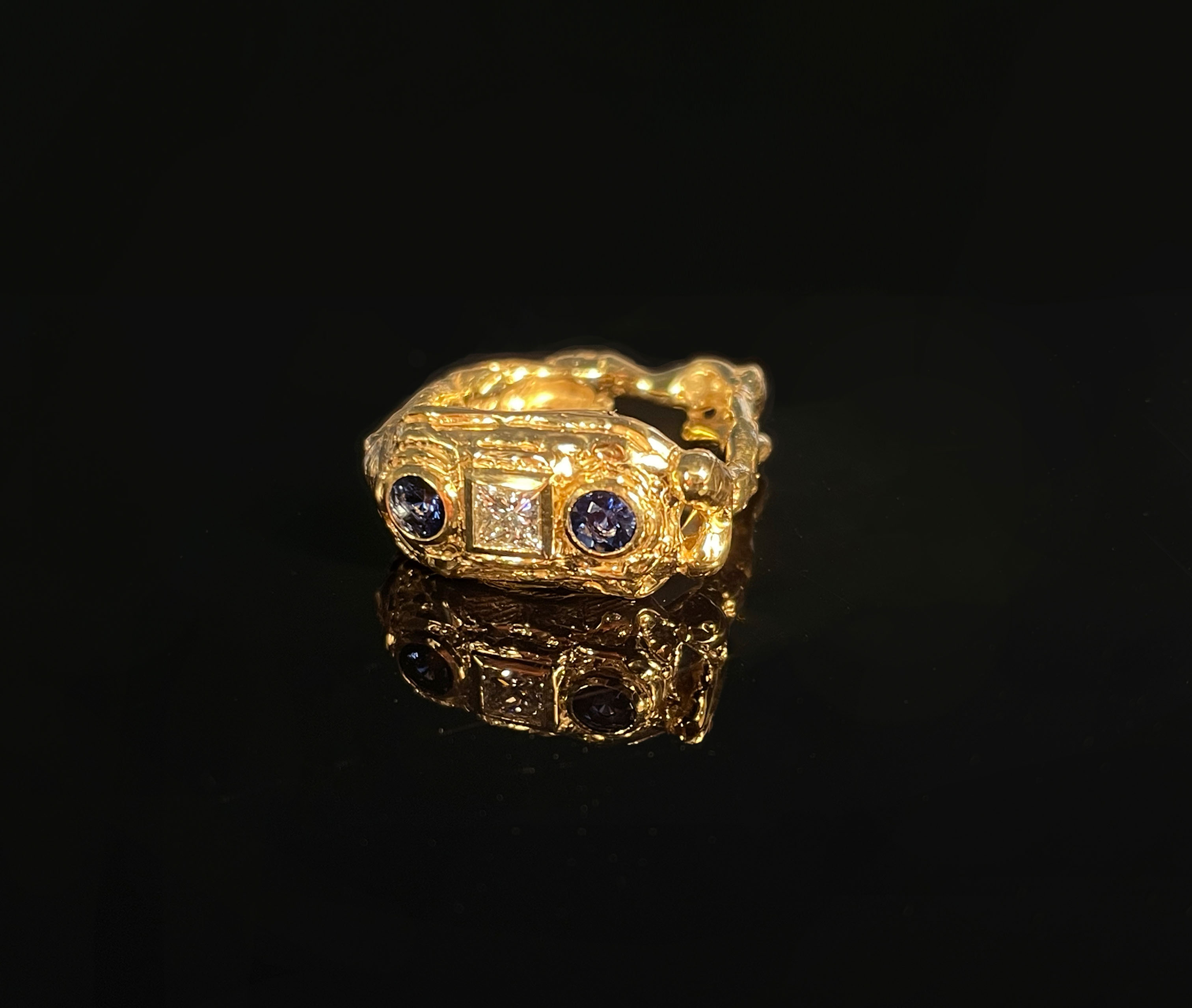 MELUSINE.18CT RECYCLED GOLD MELTED AROUND ETHICALLY EXCAVATED MALAWAN SAPPHIRES & A PRINCESS CUT FAIRTRADE DIAMOND