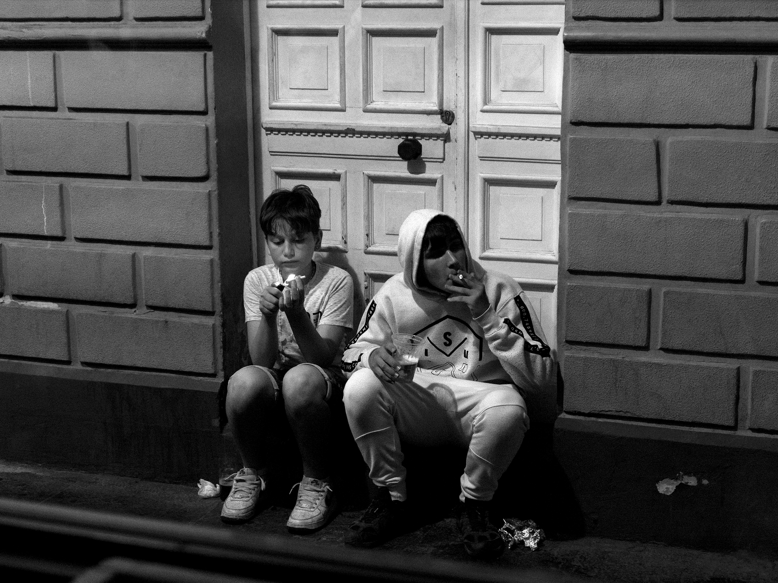 Boys smoking Pamplona, Spain, 2023photography, bw, single