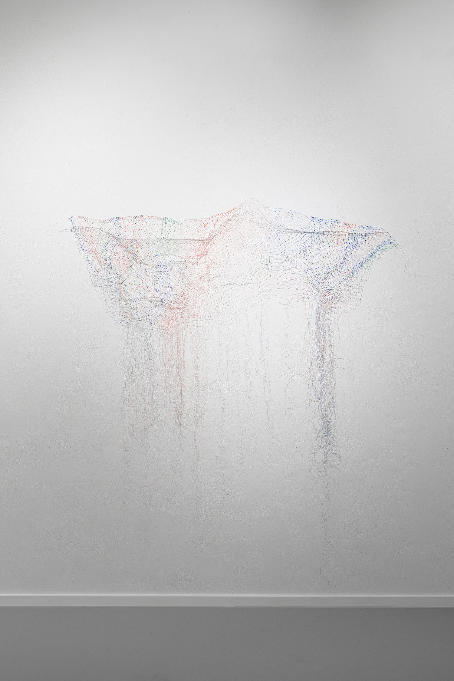 Ghost Net (Dolly), installation, 2024 (in process), plastic threads from fishing waste found and washed ashore from the North Sea and Baltic coasts, hand-knotted, 220 x 70 cm; project funded by Liebelt-Stiftung 2024