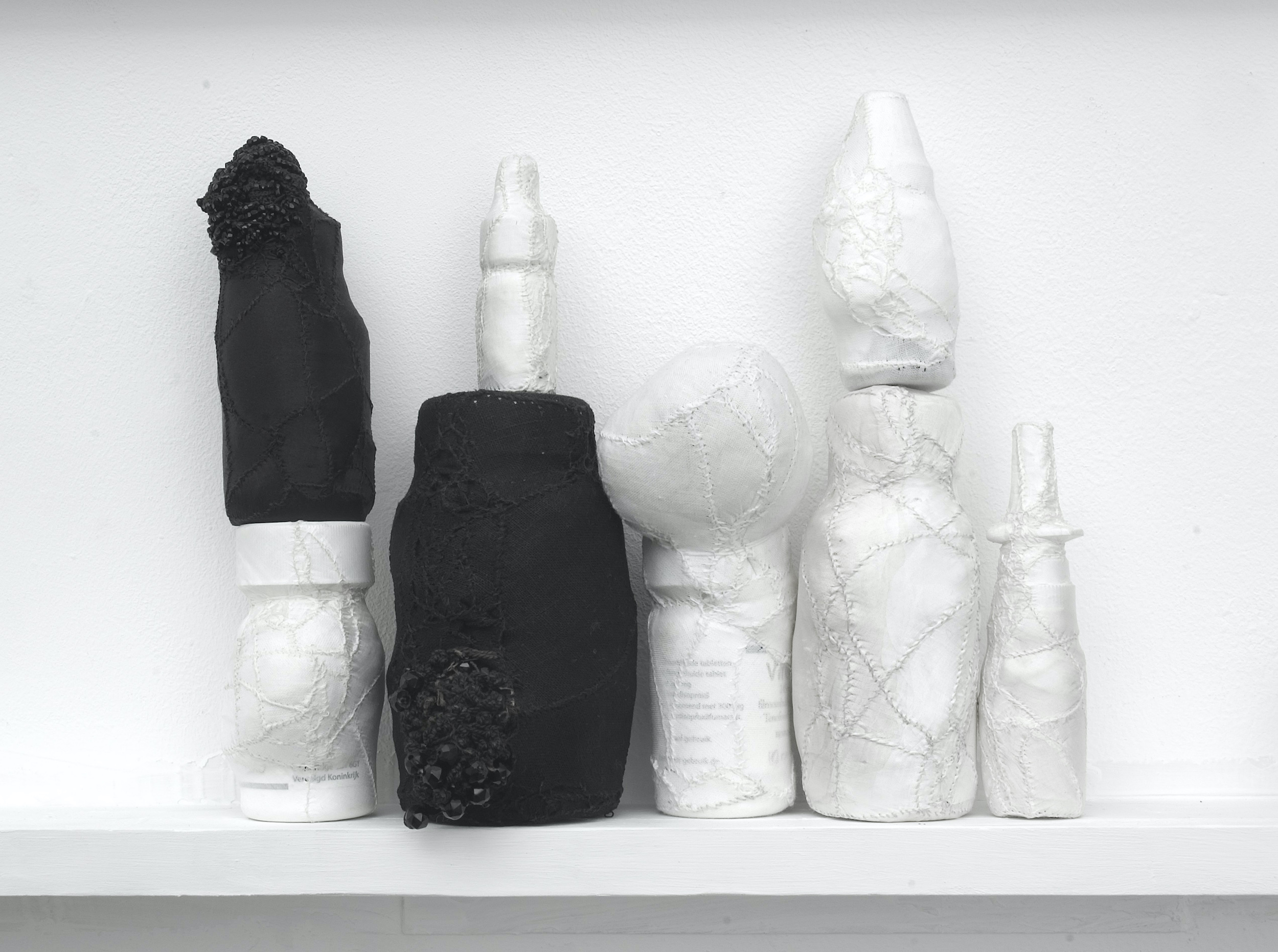  Pharmacy Deluxe, 2007 . Empty medicine bottles covered and embroidered with various fabric . Sizes and dimensions variable. 