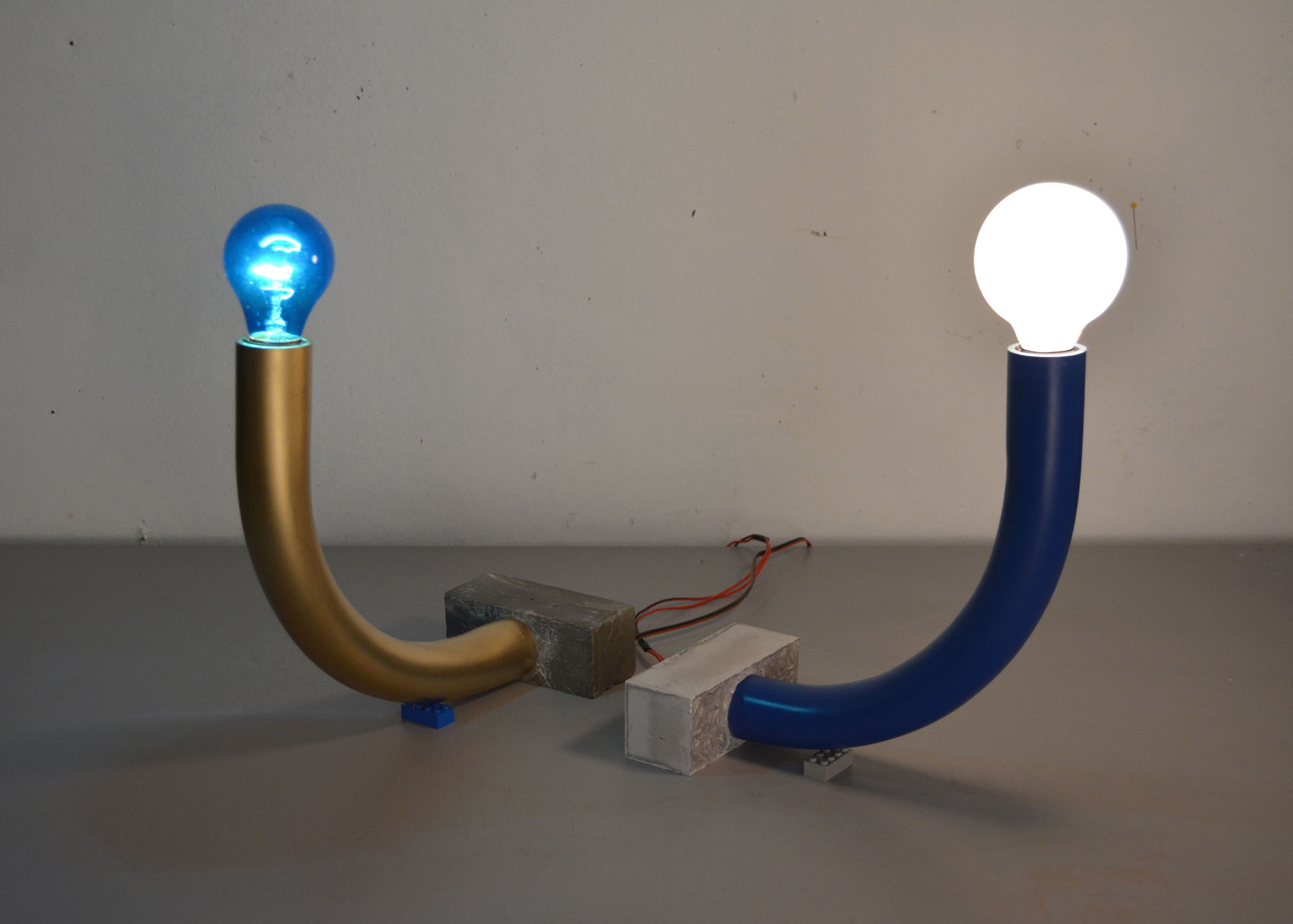 'Bendy Tube Lights', 2014. PVC, concrete, light bulbs, legos.