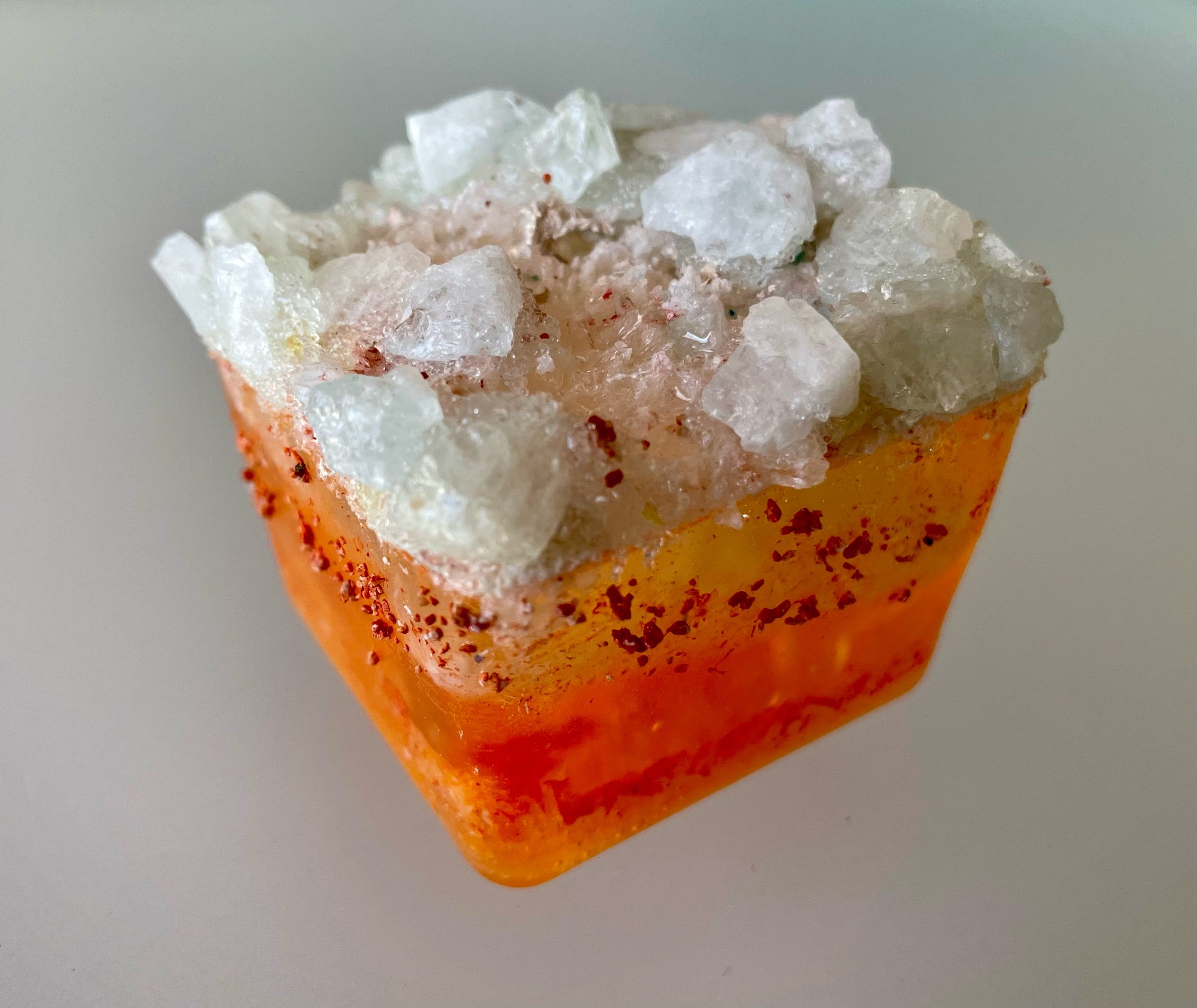 Orange Terraform I & II: Orange and Cream; Aquamarine, crystal quartz, phosphorescent mineral powder, dyed pumice, glass, resin, 2”x2”x2.5”