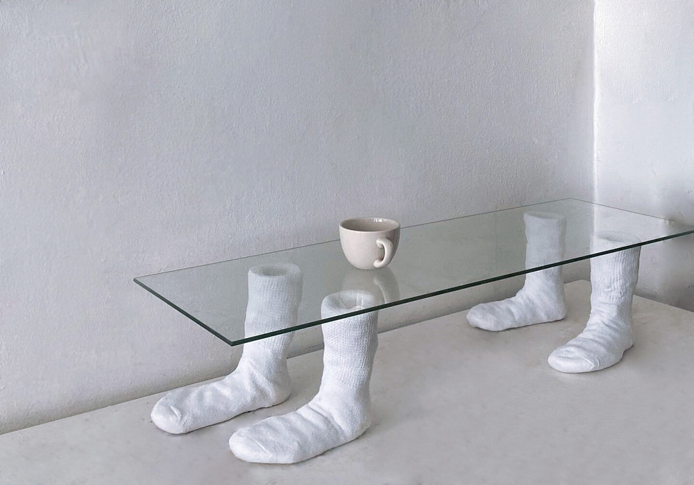 Intersection of coffee table and labor. 2020. 1 x 3 ft. US 8 / EU 38.5. Found glass, wire, plaster, cotton. 