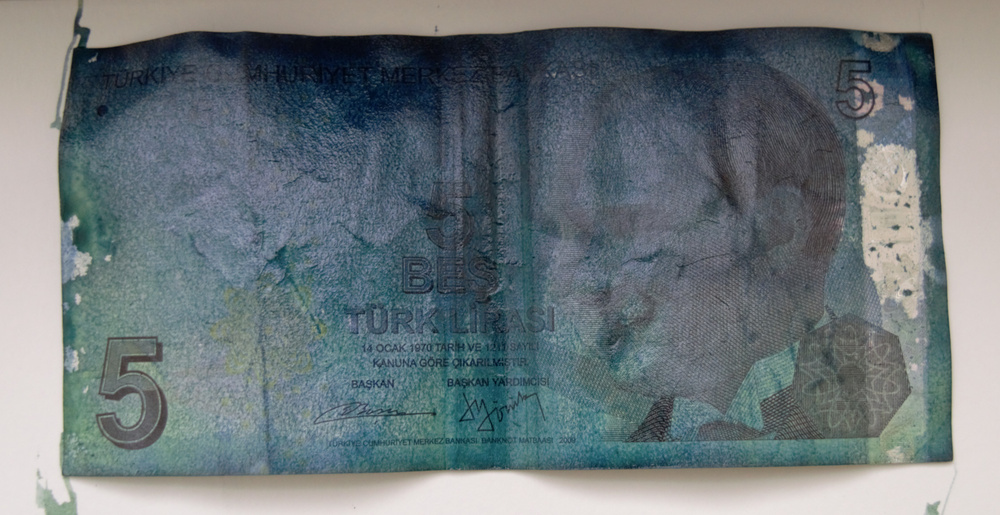Counterfeit detectors use UV light to reveal authentication marks on bills. Reversing the process allows counterfeiting to be detected.