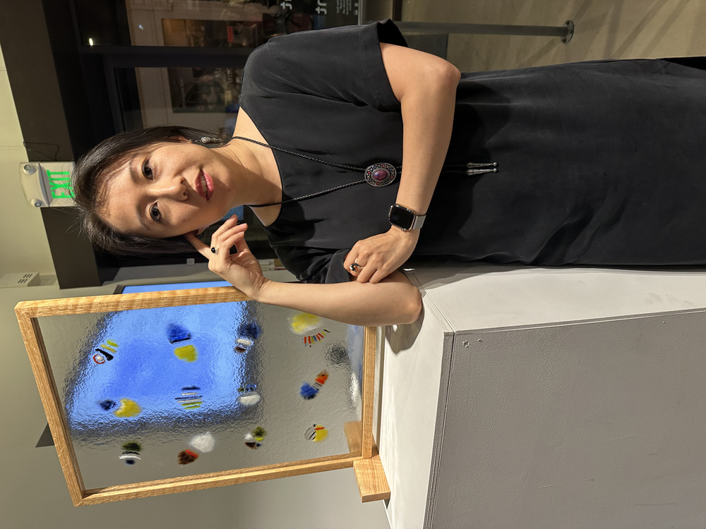 Poet writing during the performance