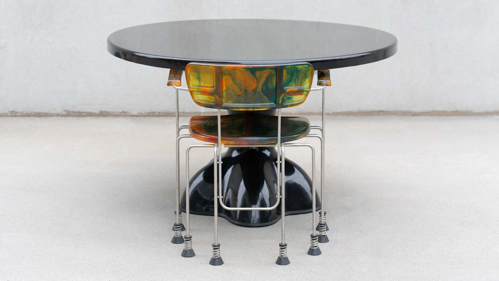 pictured alongside the wendell castle molar table is the Gaetano Pesce broadway armchair multicolor 8 leg bernini 1990s luxury prop rental nyc 
