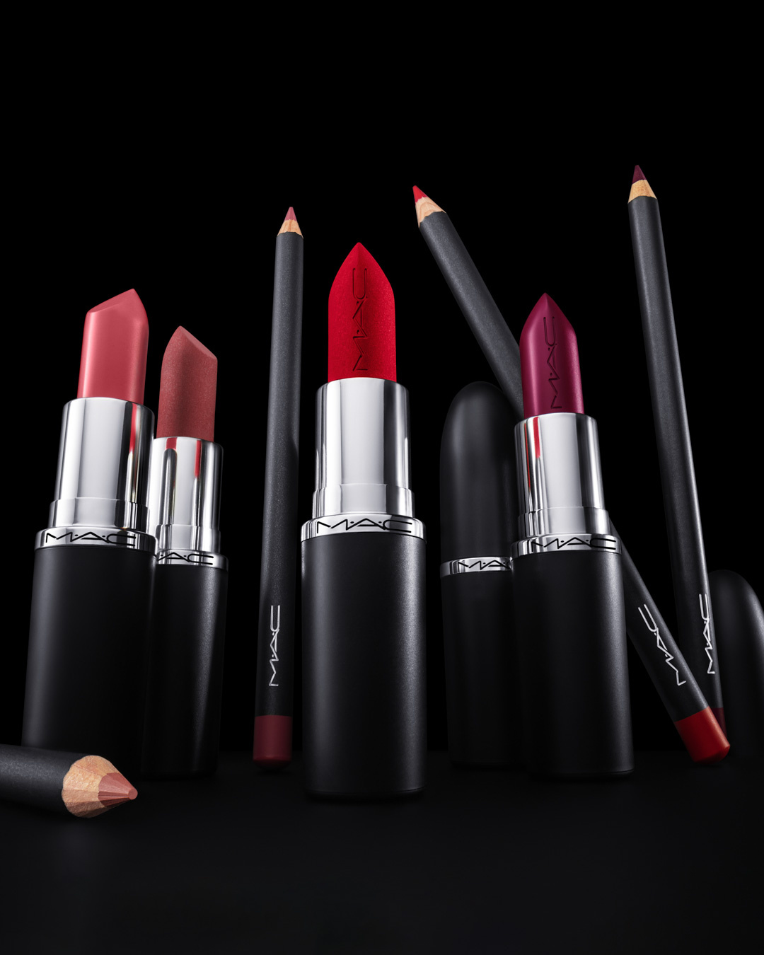 KMA stylist Rachel Haas designs set for photo of many shades of concealer sticks on black background for Hourglass 