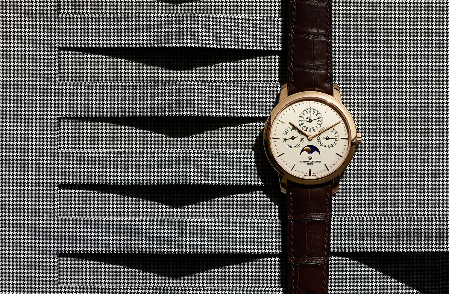 KMA photographer Isabelle Bonjean photographs Cartier watch against black and white checkered background