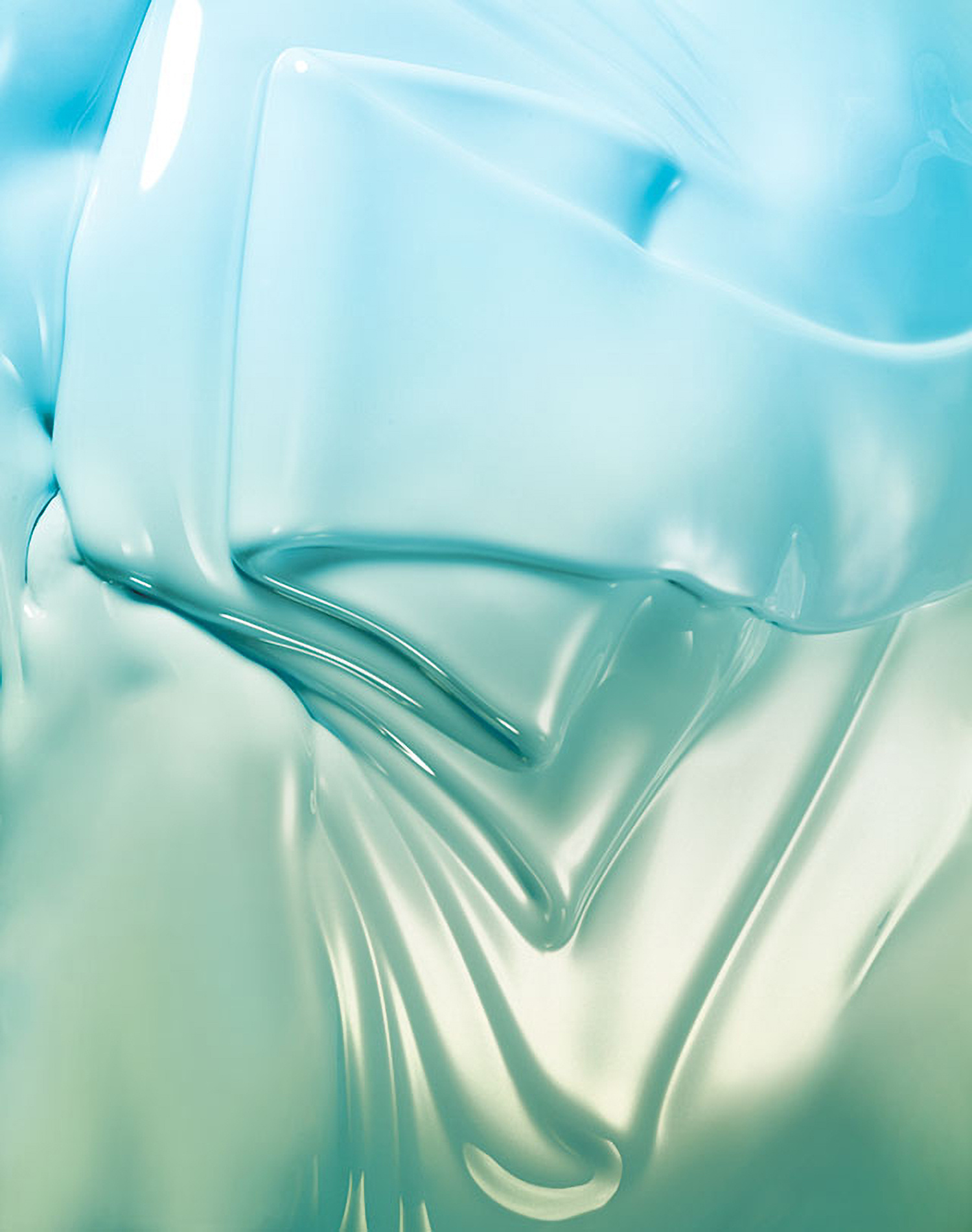KMA photographer Daniel Schweizer shoots a texture photo of blue and green shimmery paint dripping down 