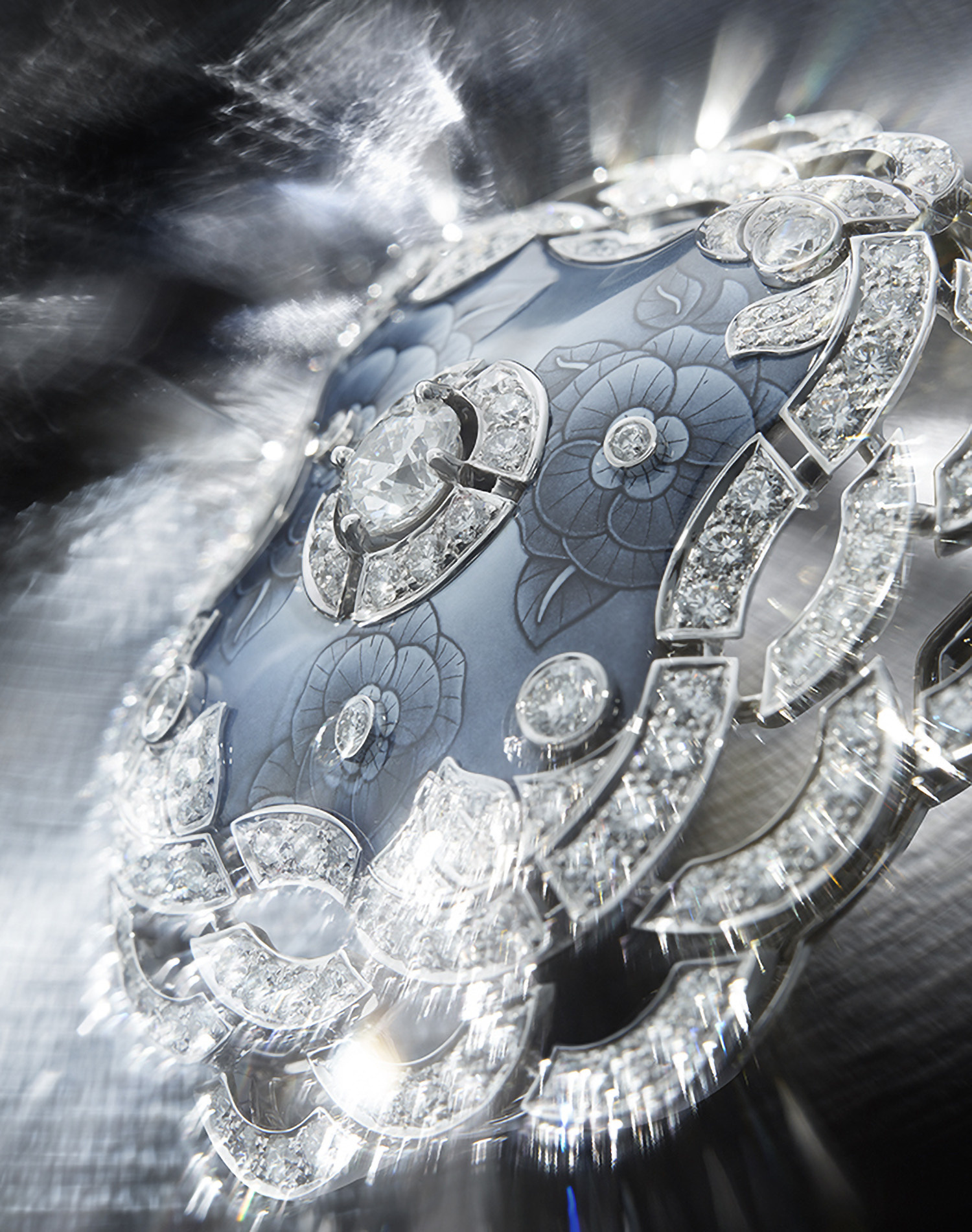 KMA photographer Daniel Schweizer photographs a diamond necklace pendant for Chanel with a shimmery background 
