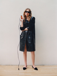 Yves Saint Laurent trench, Acne Studios sunglasses, Totême shoes.