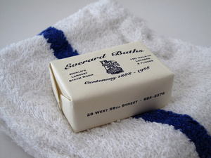 detail of soap, surrounding an image of Poseidon on a half shell with trident, the label reads "Everard Baths / Centenary 1888 - 1988 / World's Largest Steam Rooms /  150 Walk In Lockers 4 Floors /  28 West 28th Street - 684-2276"