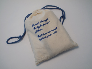 drawstring canvas bag with blue script print