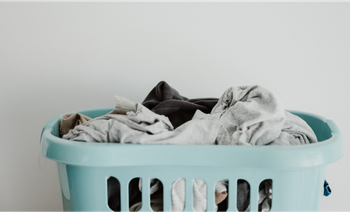 A laundry basket filled with clothes.