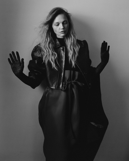 Khaite bodysuit, jacket, skirt, bag. 