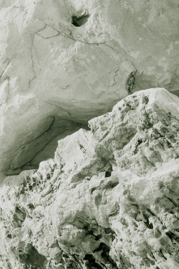 Fine art photograph of two different textured rocks reminiscent of waves shot by UK-based photographer Ilayda Akarca