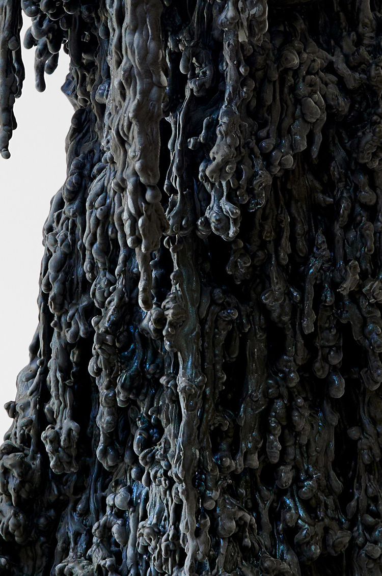A detail of layers of accumulated black wax drippings. Some areas have an ashen coating, while others have a subtle blue green sheen. For Release is the physical artifact of a ritual Margaux Crump performed to release her fears.