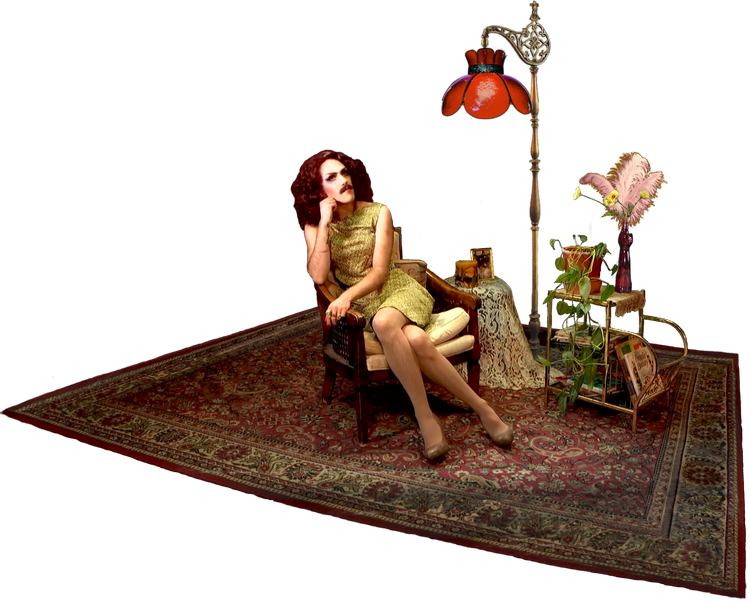 A glamourous white mustachioed drag queen with auburn hair and vintage garb, sitting on a chair and surrounded by a small feminine living room pastiche.